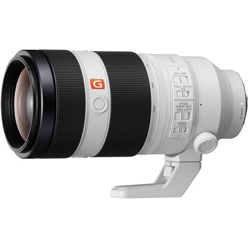 Sony FE 100-400mm f/4.5-5.6 GM lens displayed on a white background, showcasing its sleek design and professional features.
