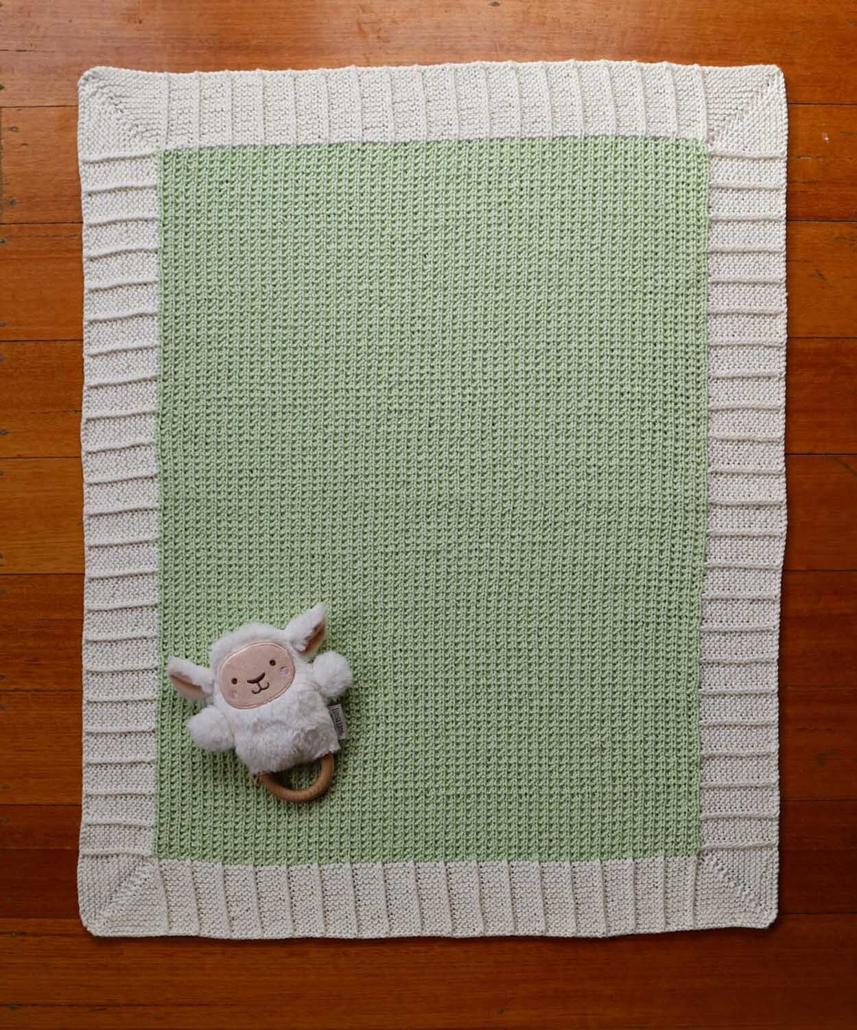 Mint green and cream knitted baby blanket. Hand make for newborn.