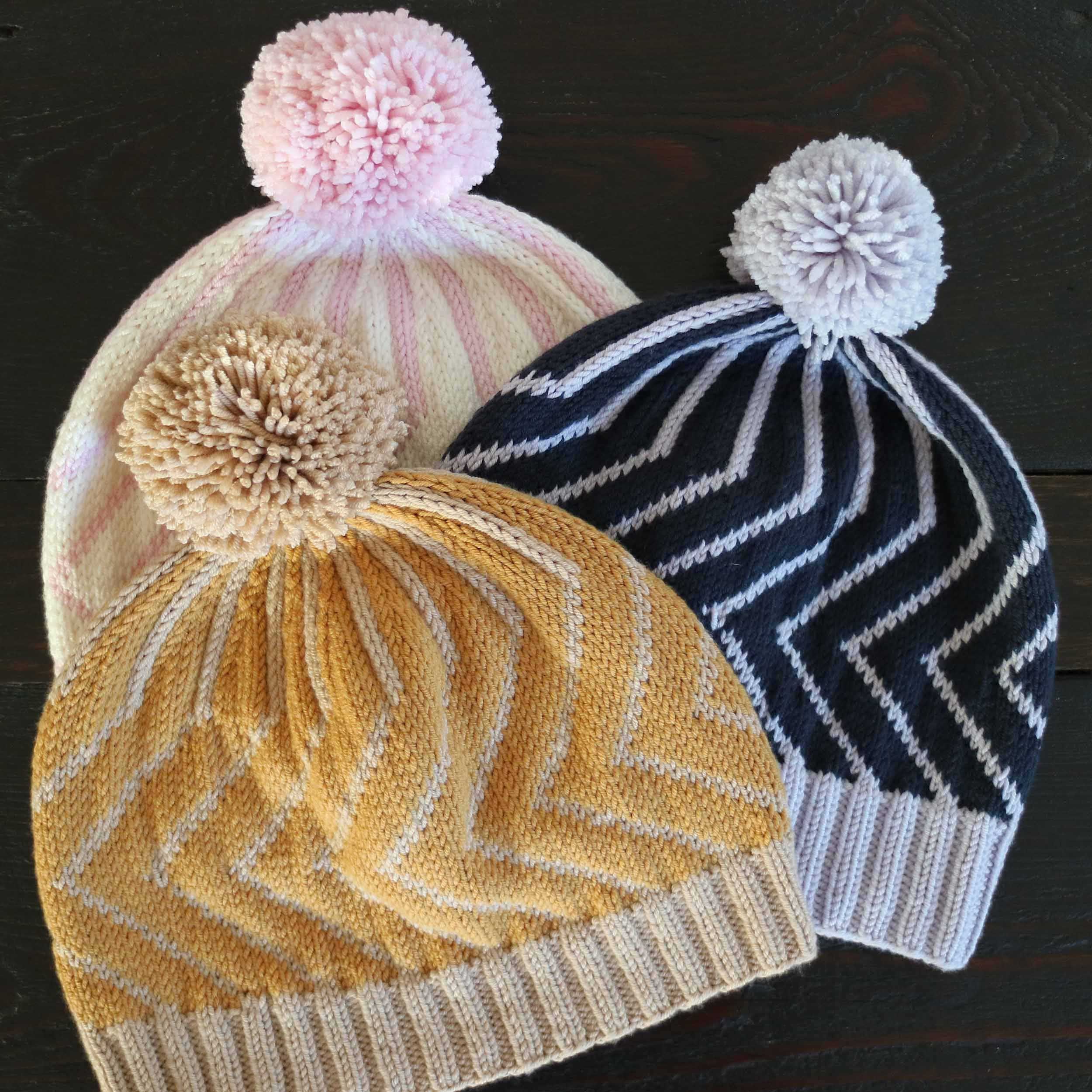 Pivot slouchy beanies with pompoms in various colours