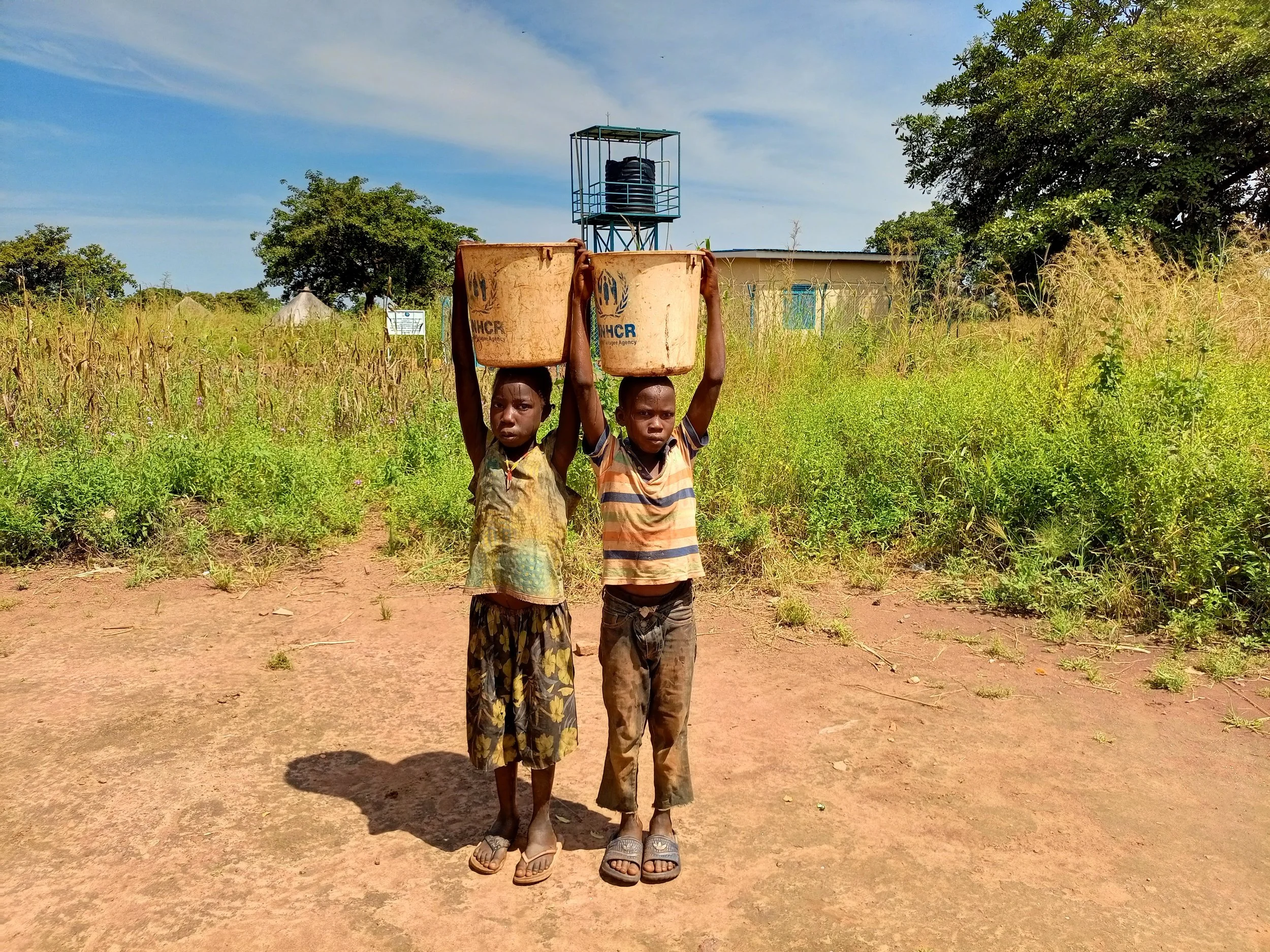 Children in front of raised water tower.jpg