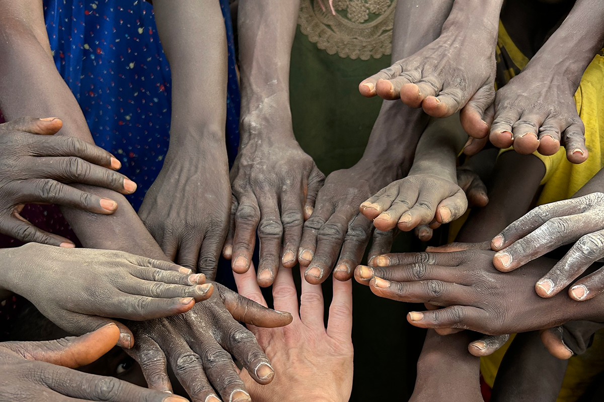 strangers hand together