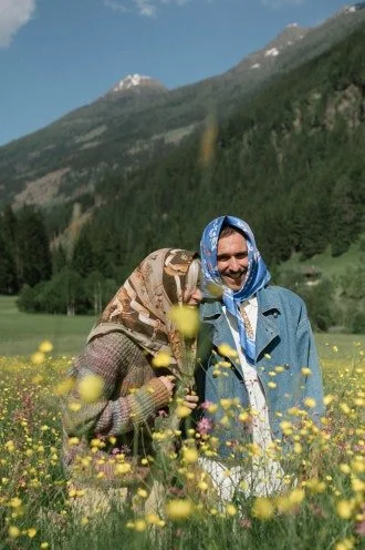 Photo of couple in front of a mountain