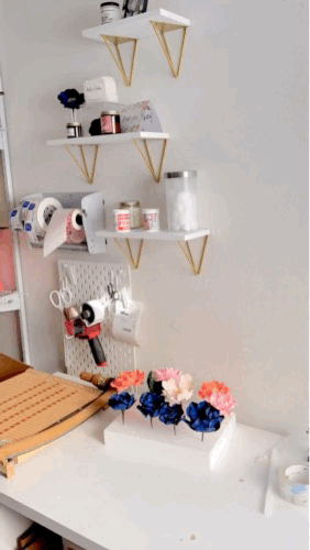gif of kelsie cakes wrapping up sugar flowers for shipping so they arrive without damage