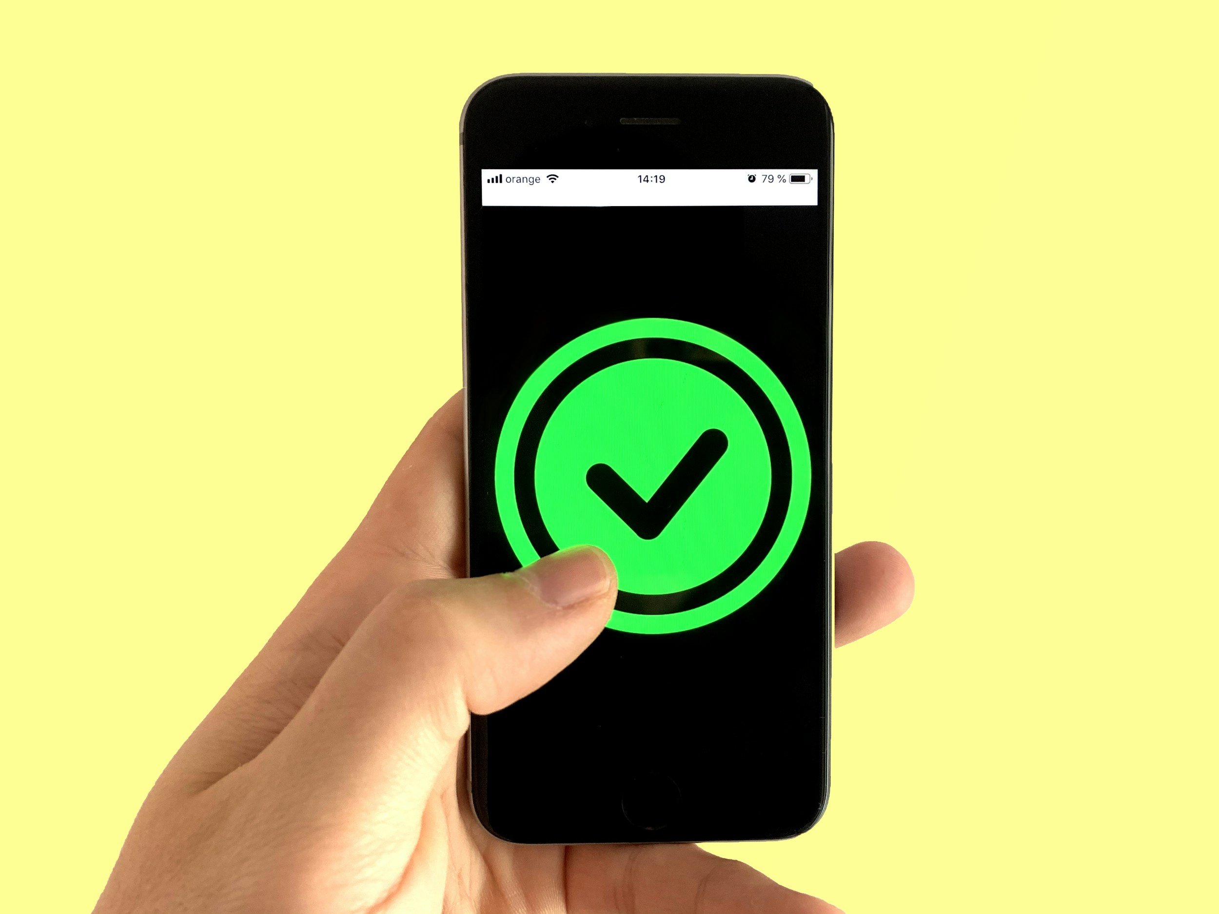 phone with a green check mark on the screen. A corrective experience. Mental Health. Corrective experience for anxiety and depression. Healing Trauma. Trauma therapy in CO. Therapy in Philadelphia