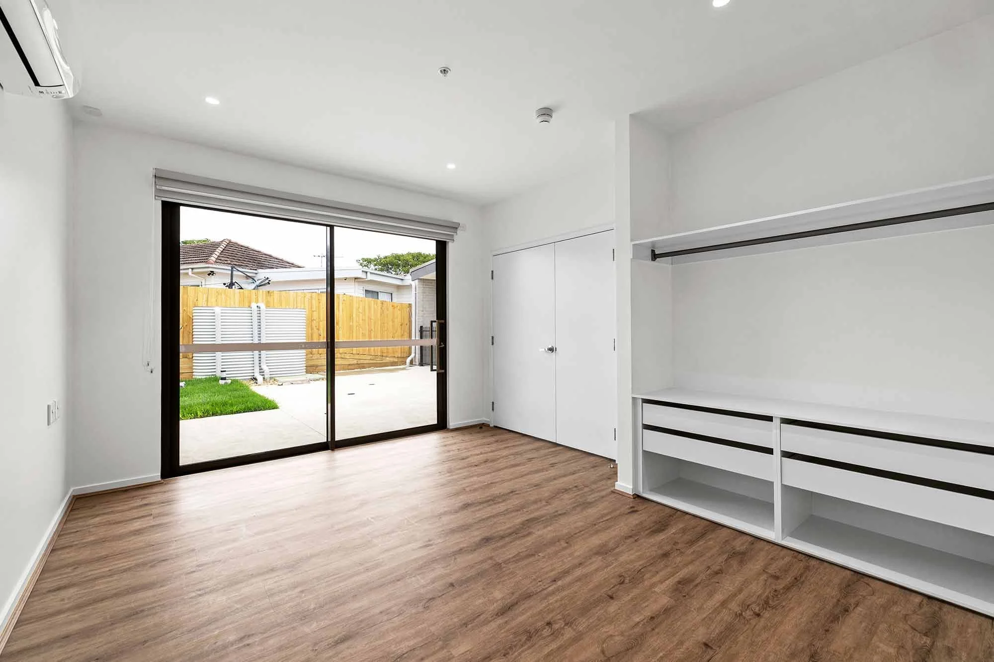 A view of the bedroom and courtyard at the Balmain and Co Rosebud SDA
