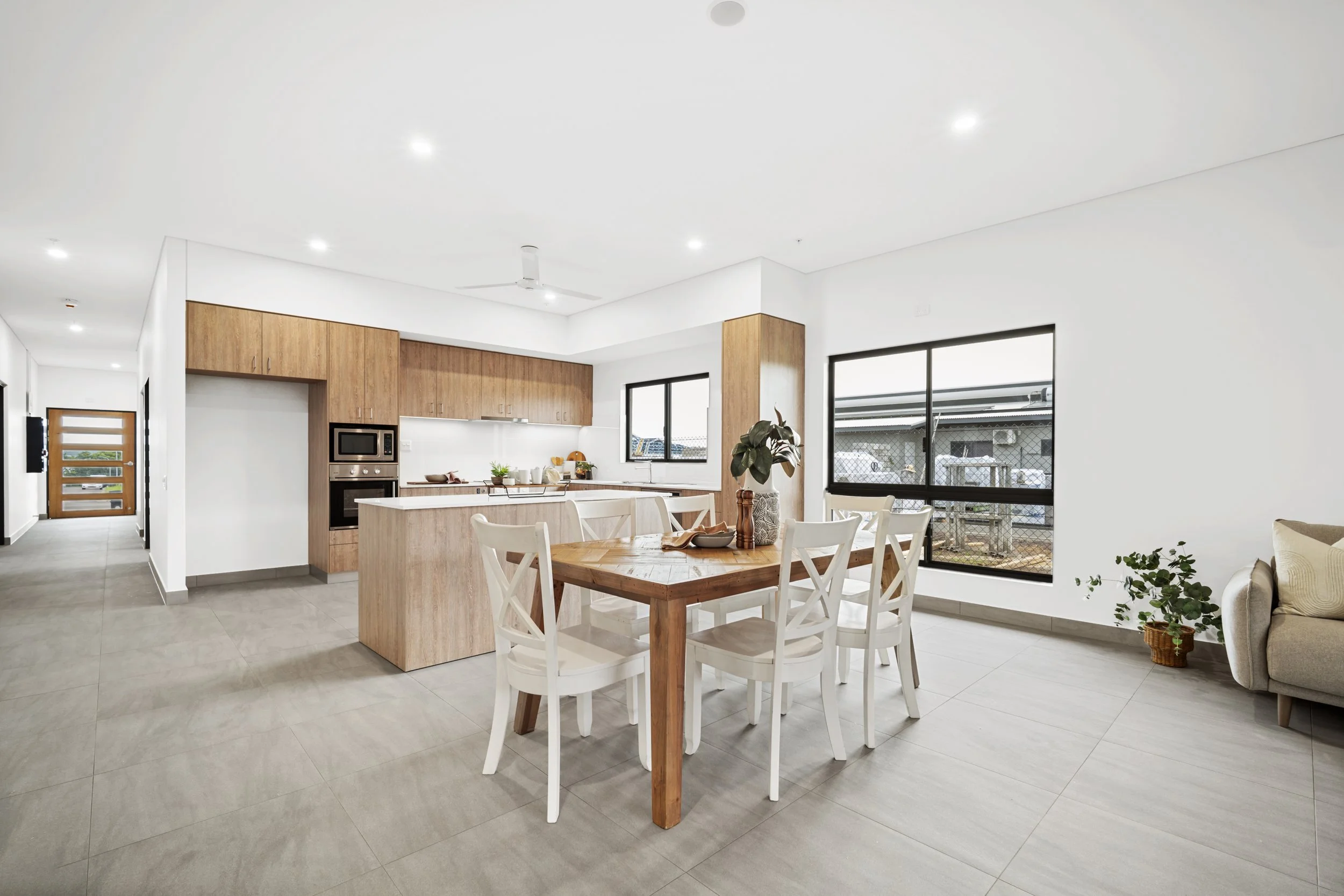 The accessible kitchen and dining space in the Leben Homes Specialist Disability Accommodation (SDA) in Darwin