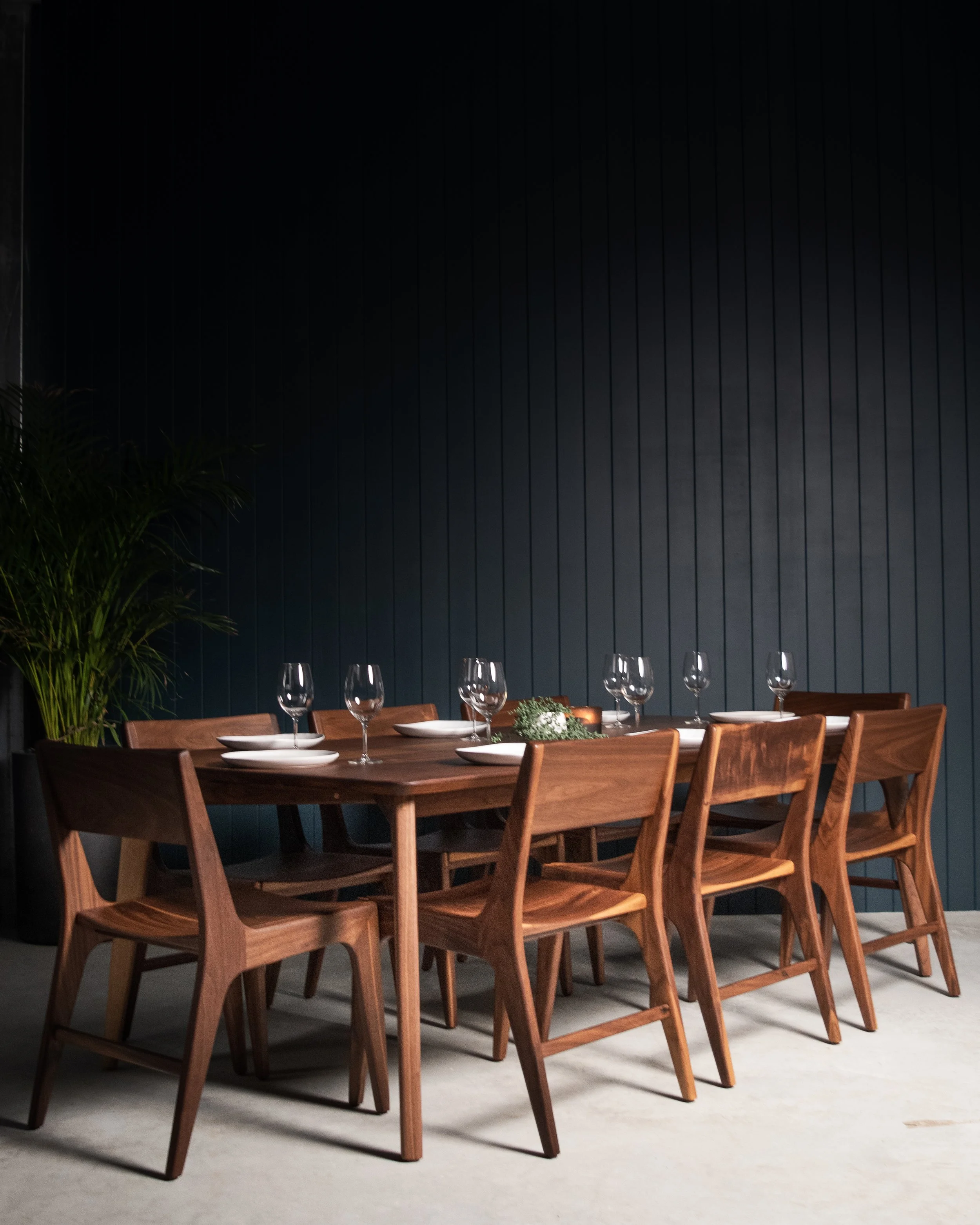 Black walnut floating dining table and Frenchman Bay chairs