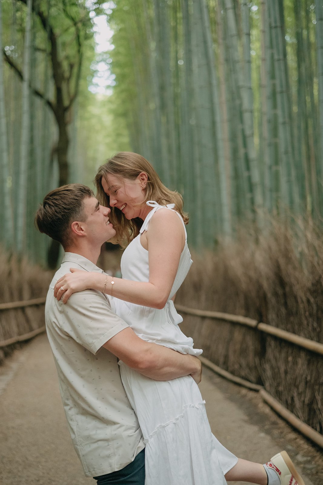 Engaged couple at Arashiyama Bamboo Forest Kyoto Japan
