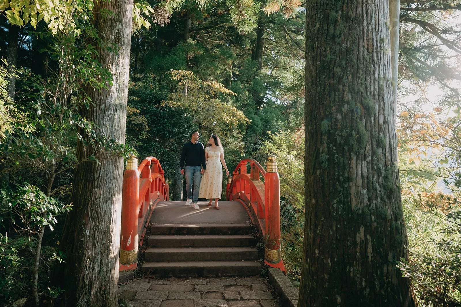 Simran and Charandeep walking beside Lake Ashi in Hakone in early autumn