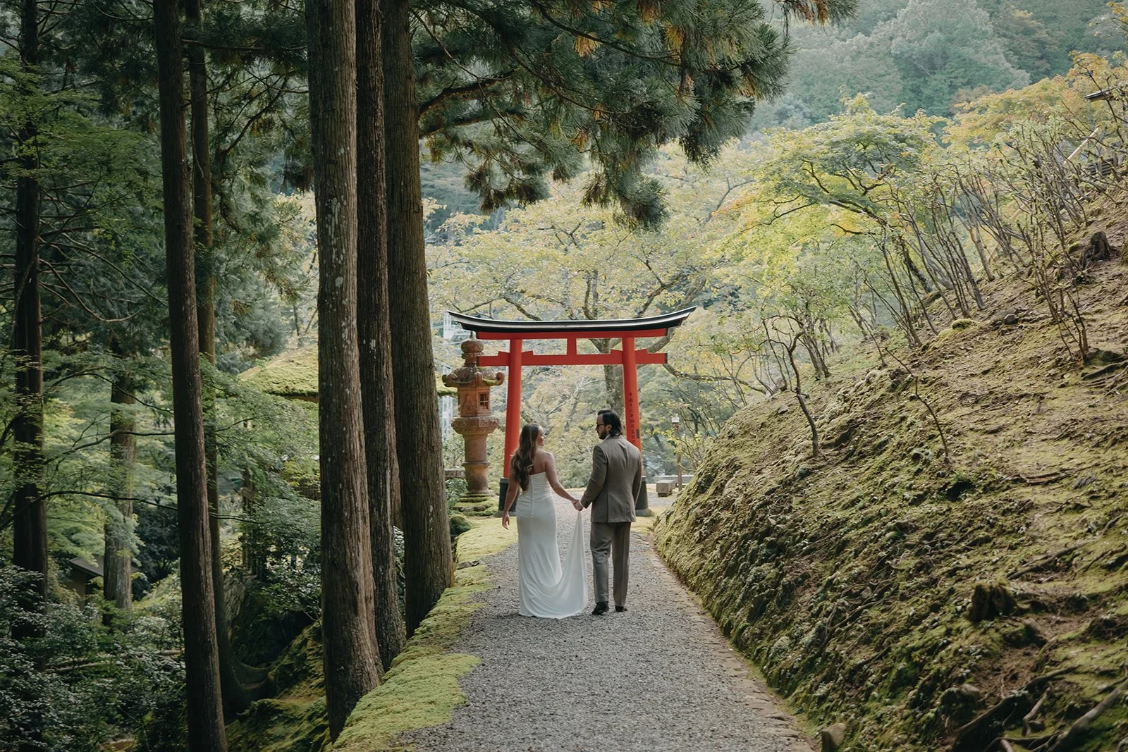 calking together through a private garden in Kyoto