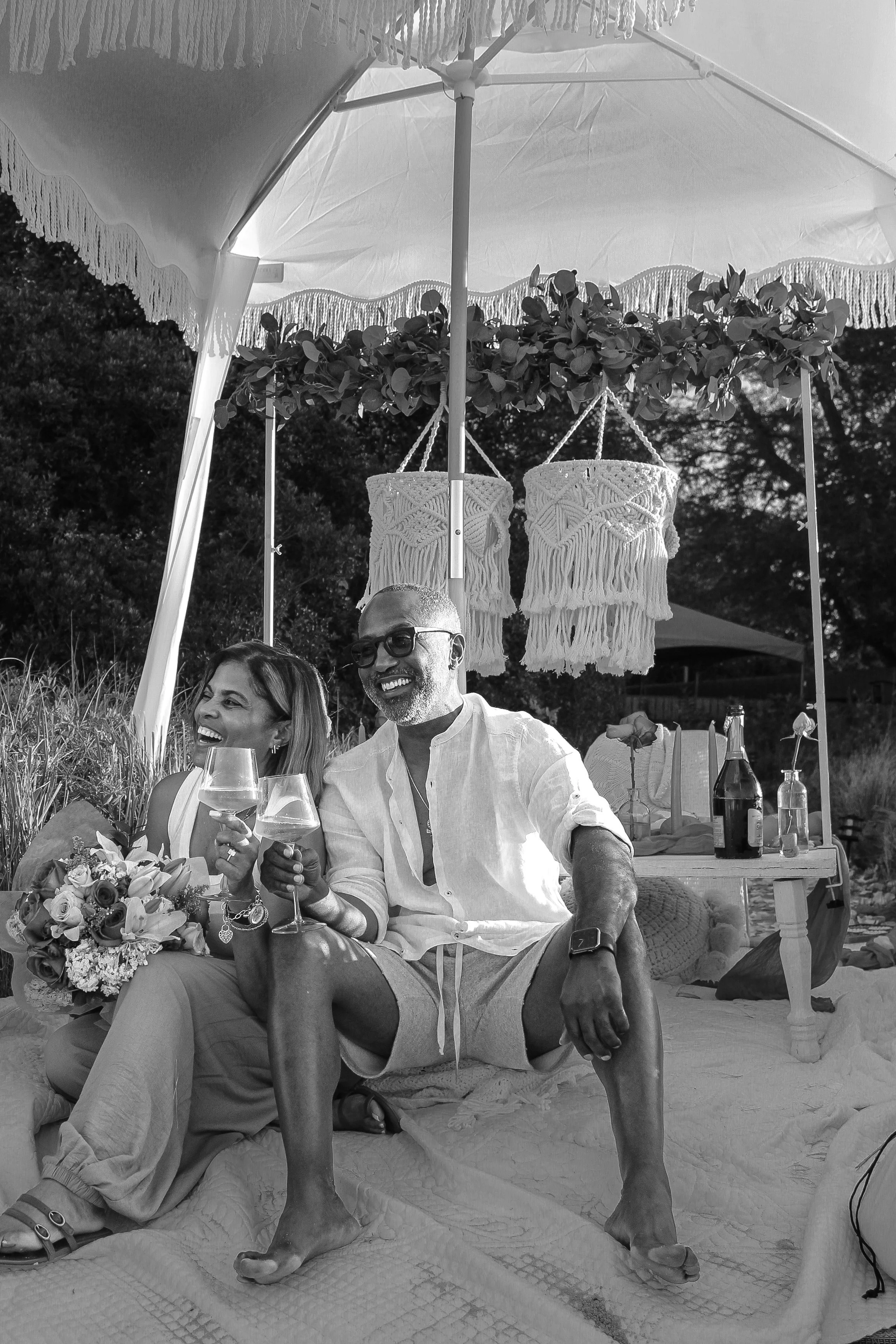 Pampas Picnics | Pretty in Pink proposal picnic with pink and green accents beneath a white beach cabana