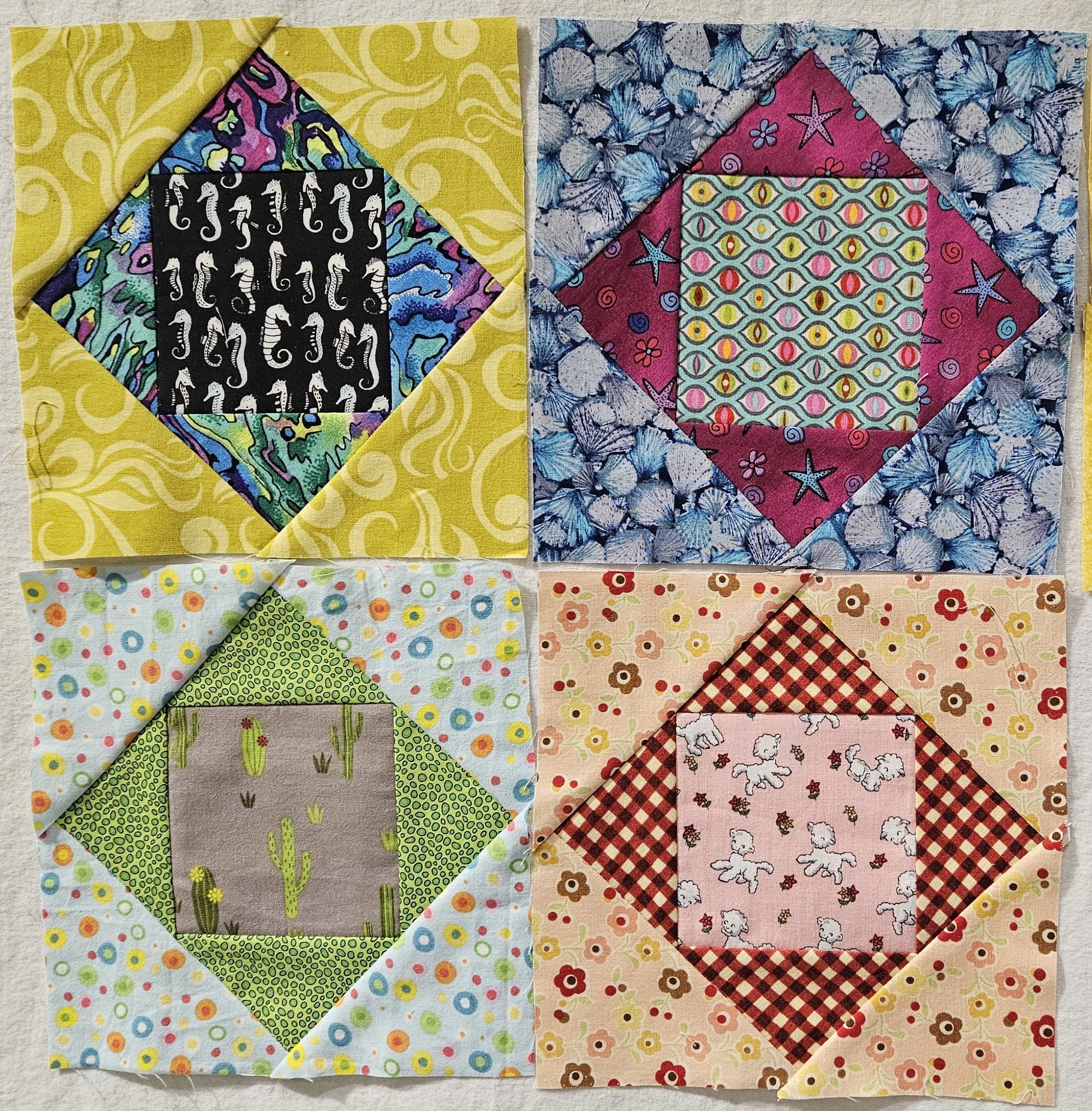 Four blocks consisting of a square, inside a diamond inside a square, all in bright colours