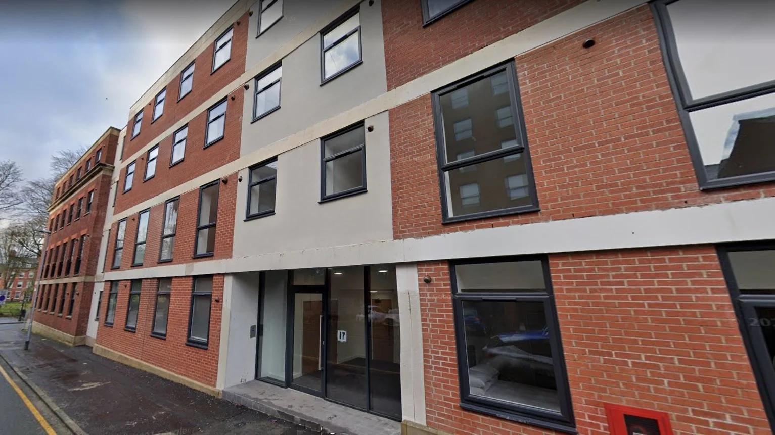 Brick apartment building with stone accents in Preston