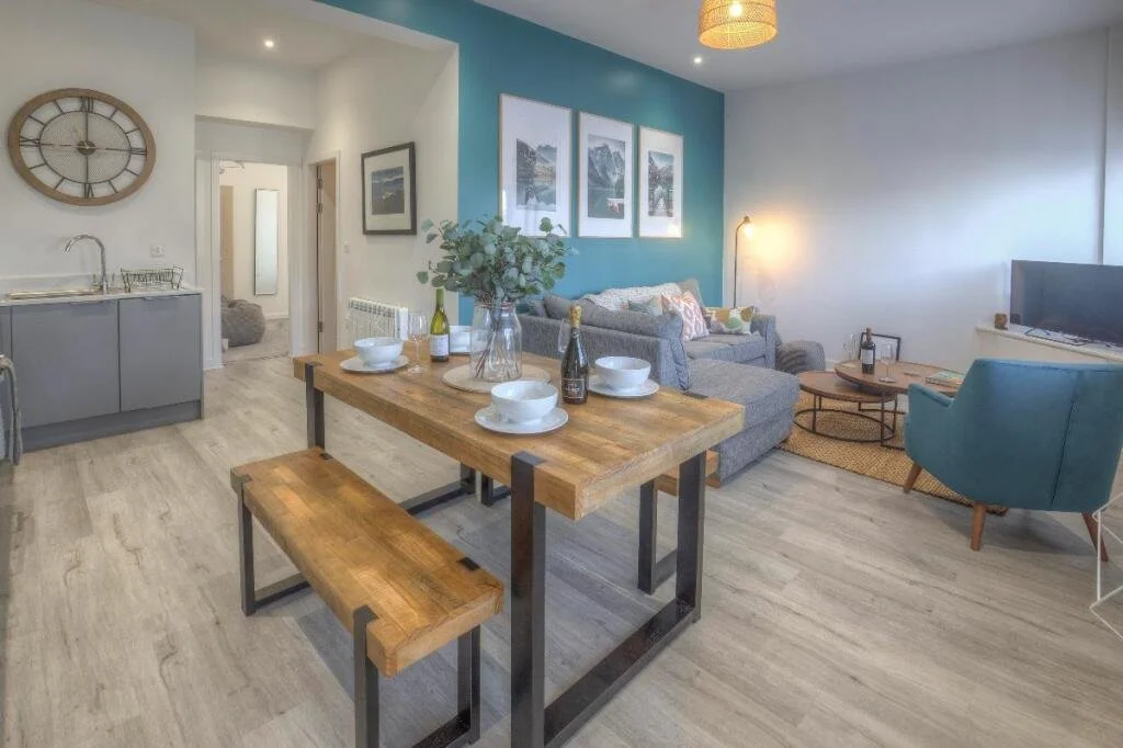 White brick Victorian Guest House with red accents