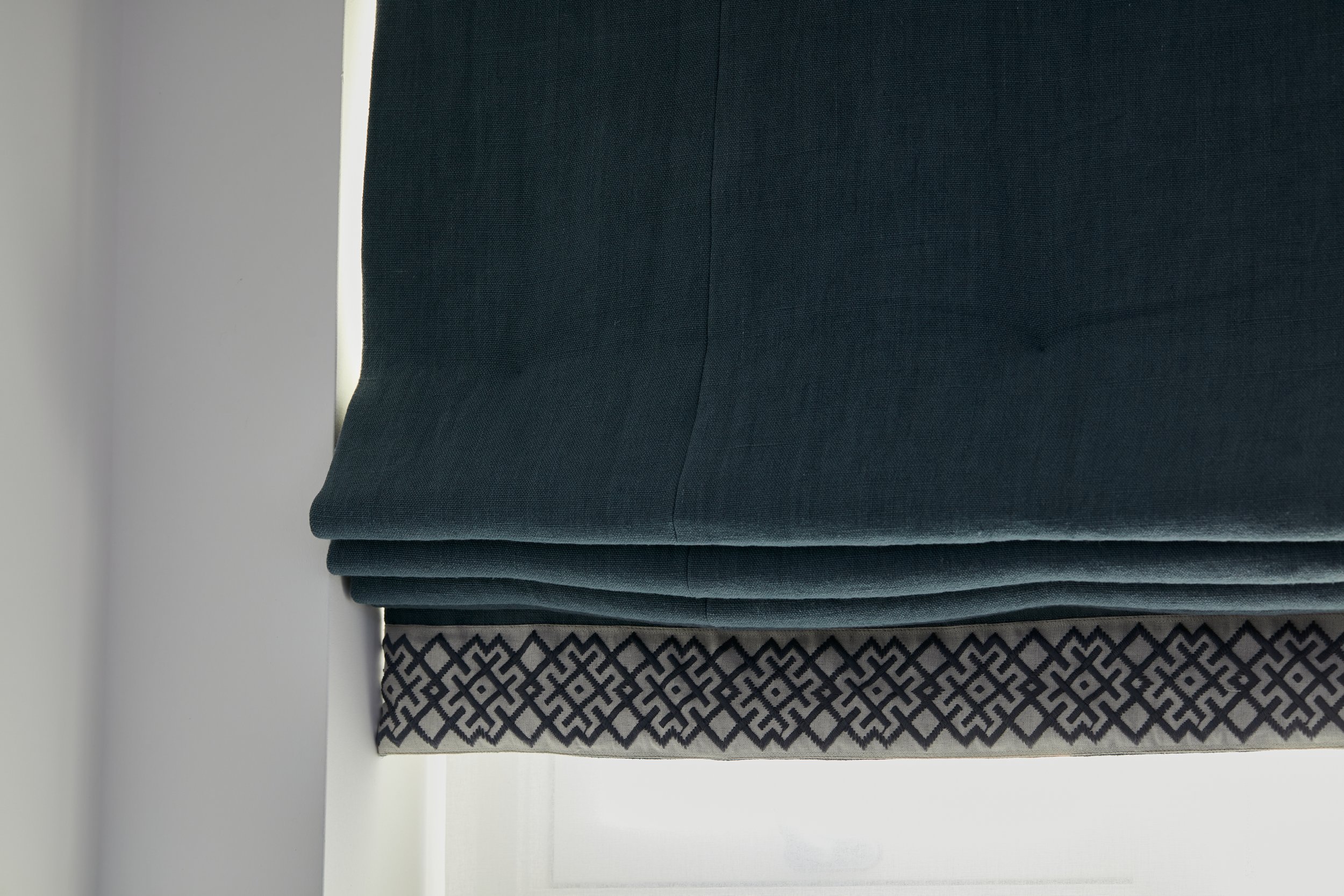 Blue bespoke Roman Blind with trim