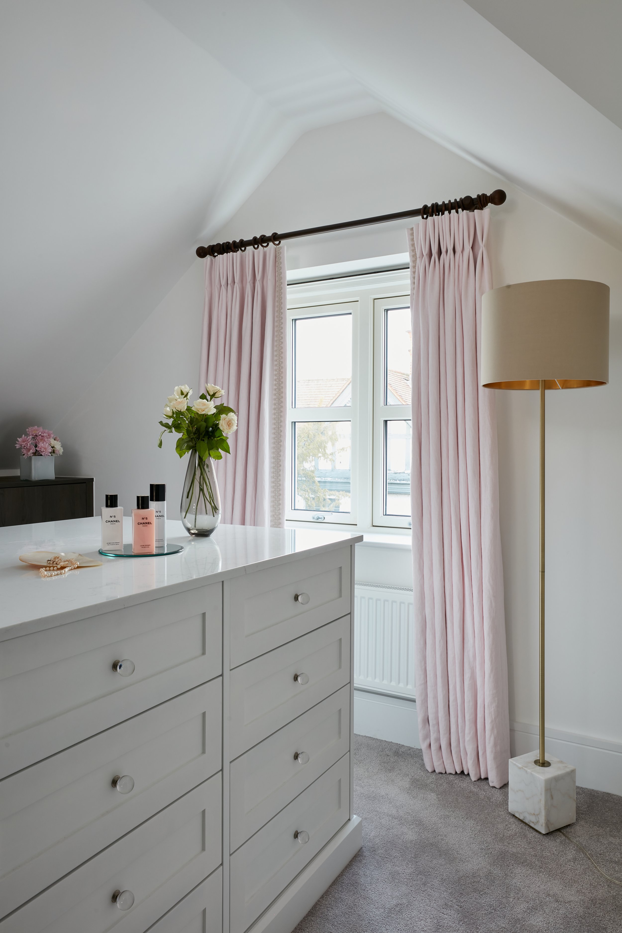 pink curtains in a master bedroom