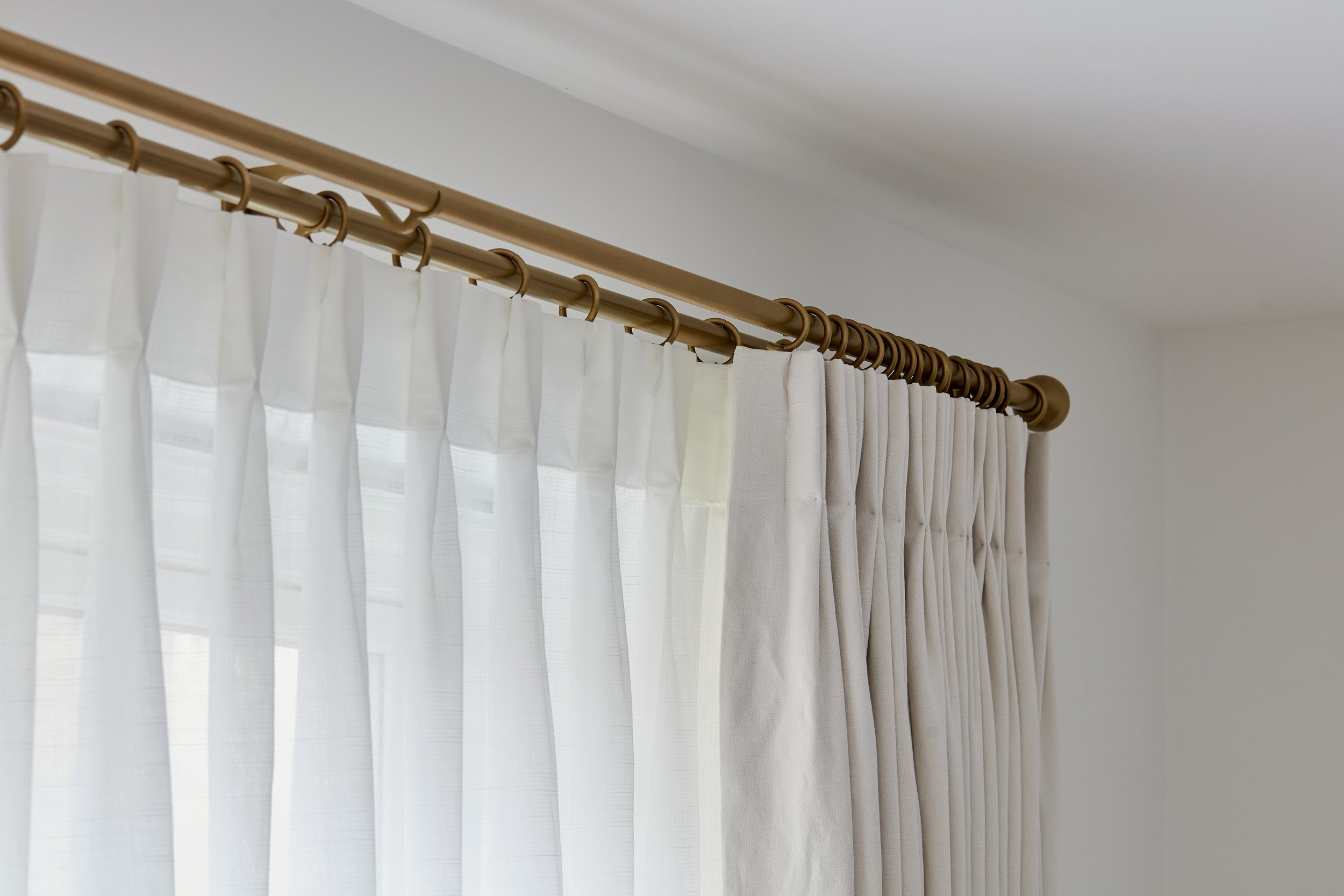 Double pole with a sheer and curtain