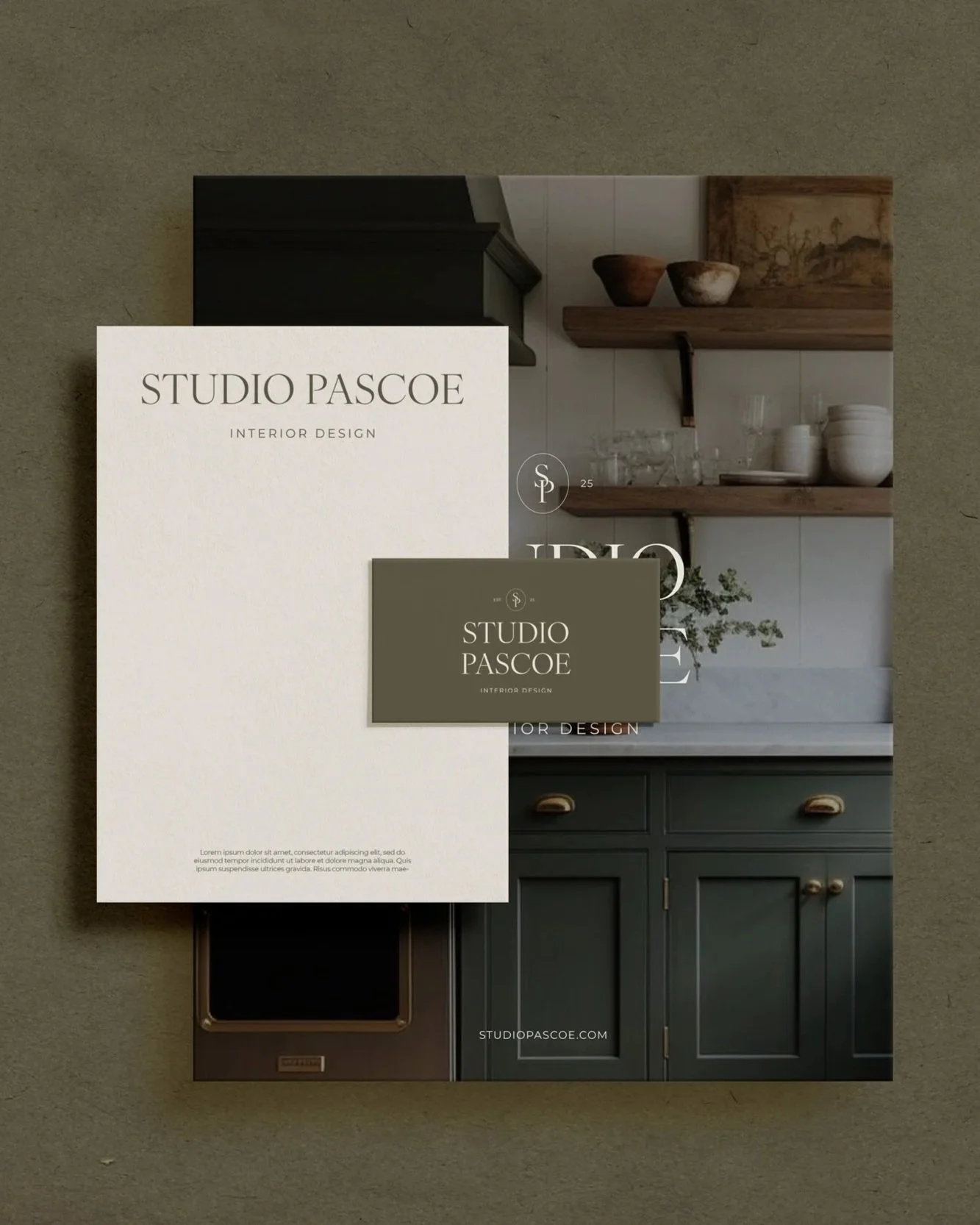 A brochure for Studio Pascoe interior design featuring a kitchen with dark cabinets, open wooden shelves, and a white backsplash.