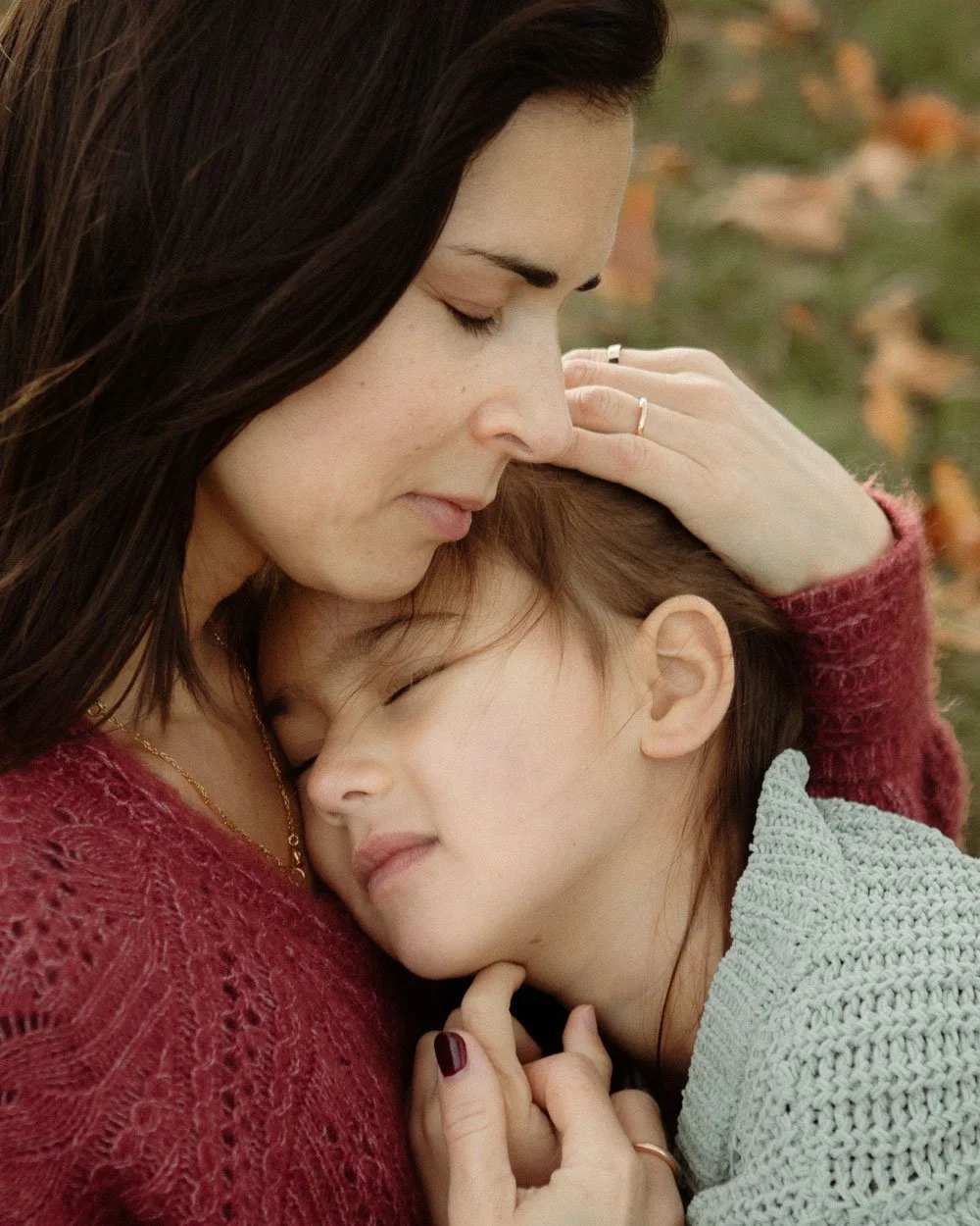 mother embracing her child in a london park
