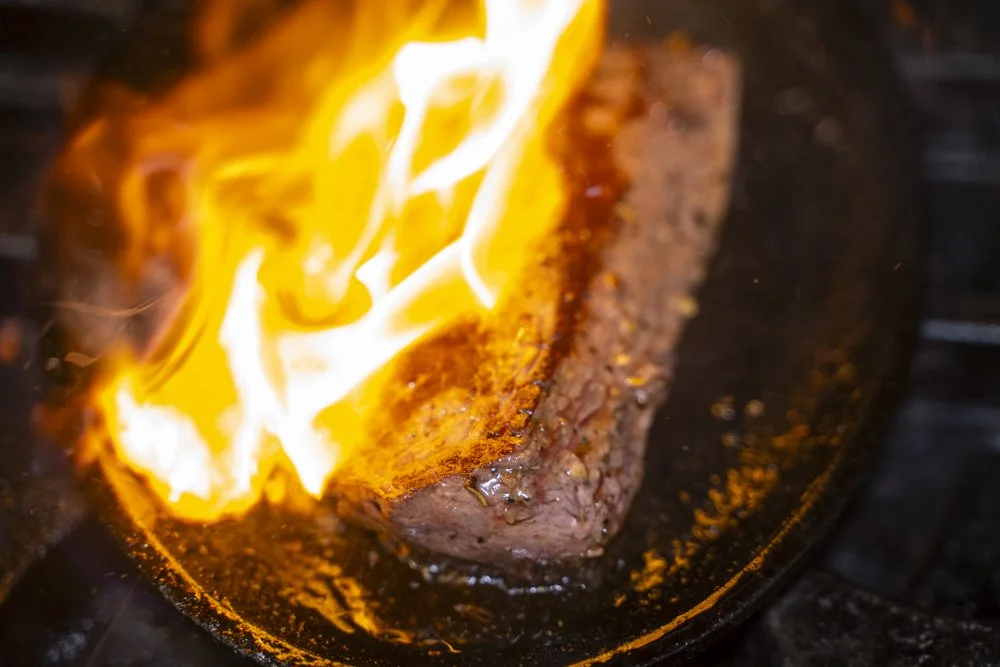 Prosperity Social Club Steak being seared with fire