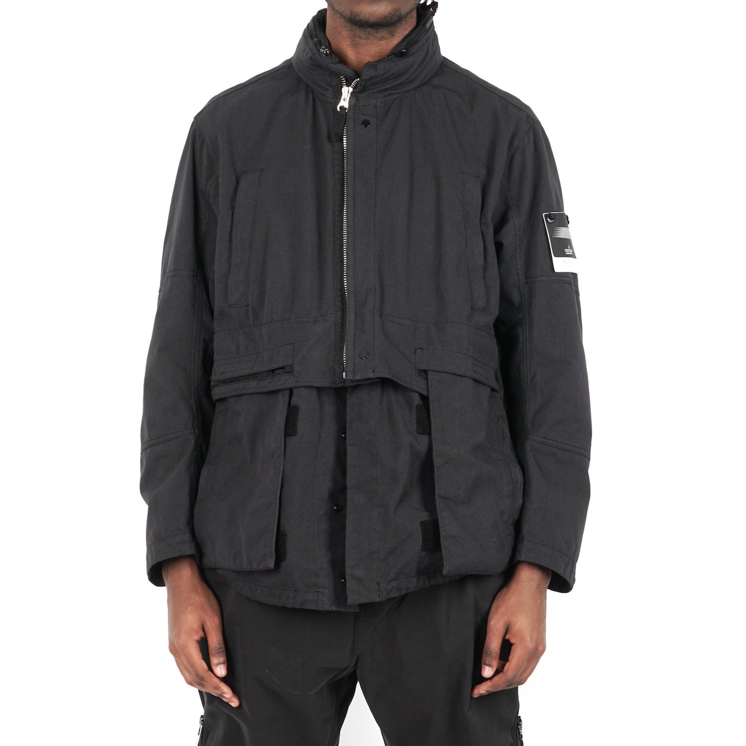 Stone Island Shadow Project Divided Field Jacket
Features: Hollowcore fabric, removable bottom half, stowable hood, water and stain resistant