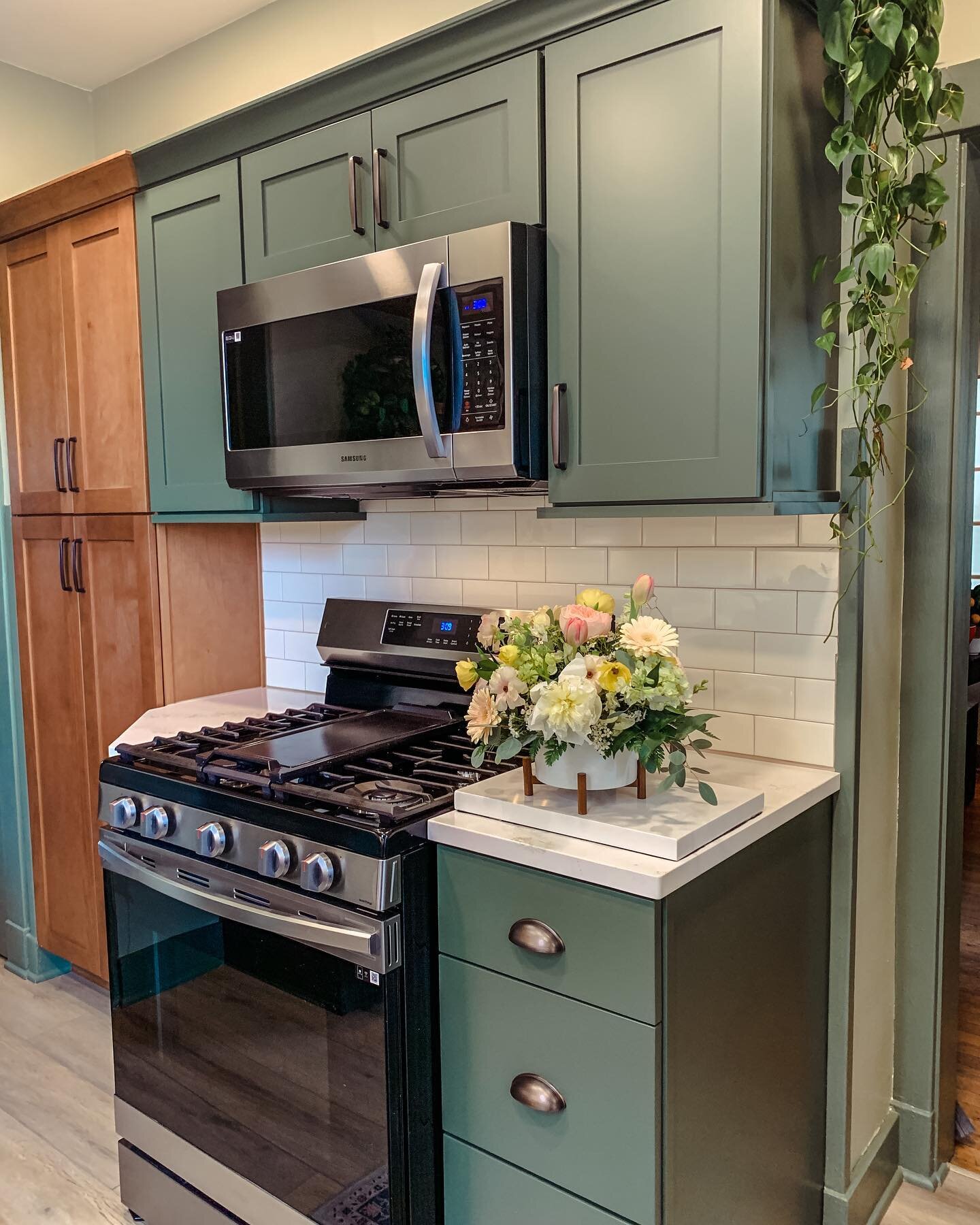 Green Cabinetry! Yes, I did! I took this smaller kitchen and created a stylish, quaint, brighter space! Green &amp; Blue cabinets are not only in style right now but they can offer a timeless look when paired with stained cabinetry, subway tile, neut