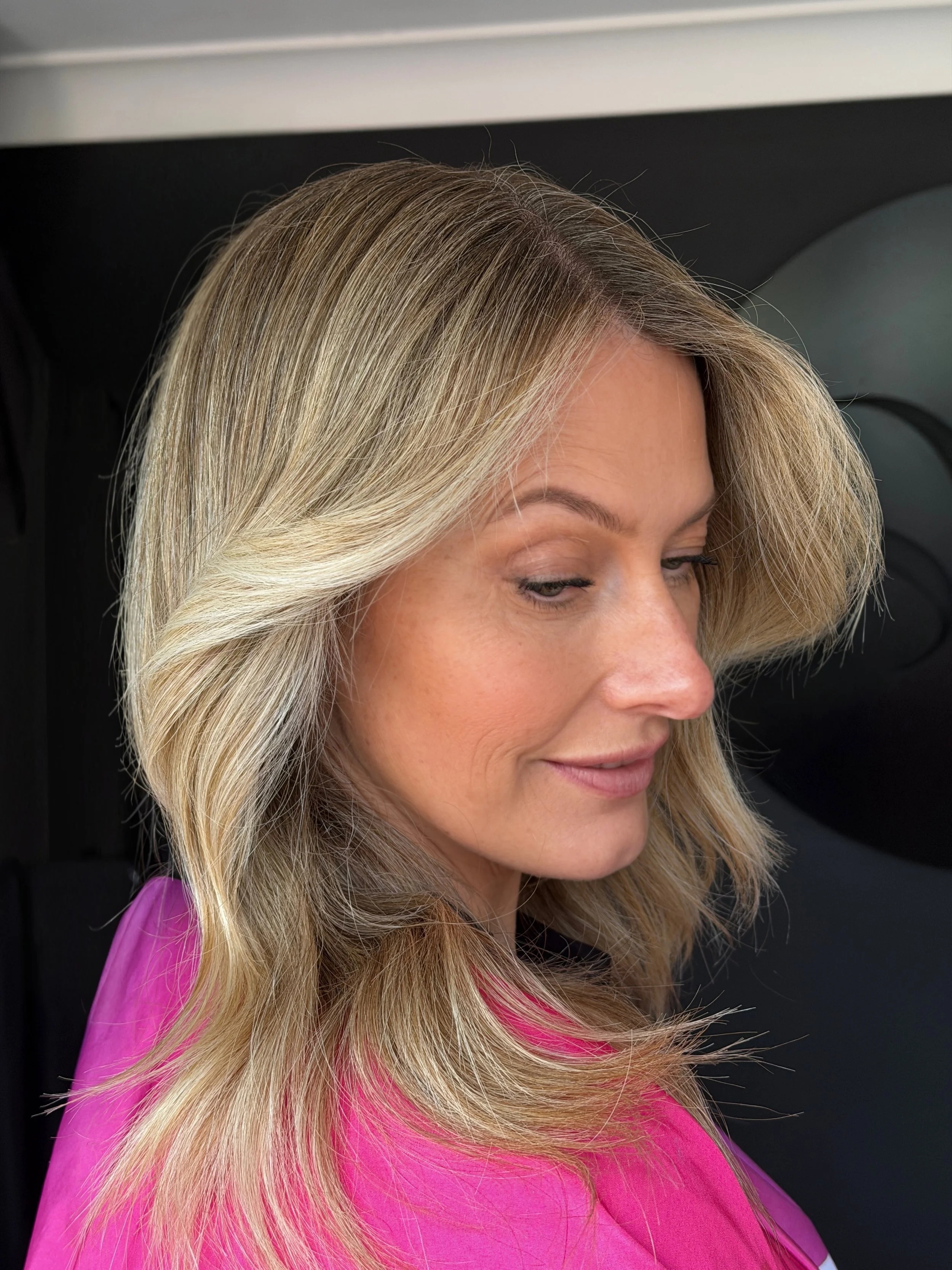 Bright blonde grey blend with soft face-framing layers by Stephen William Hair, Waterlooville