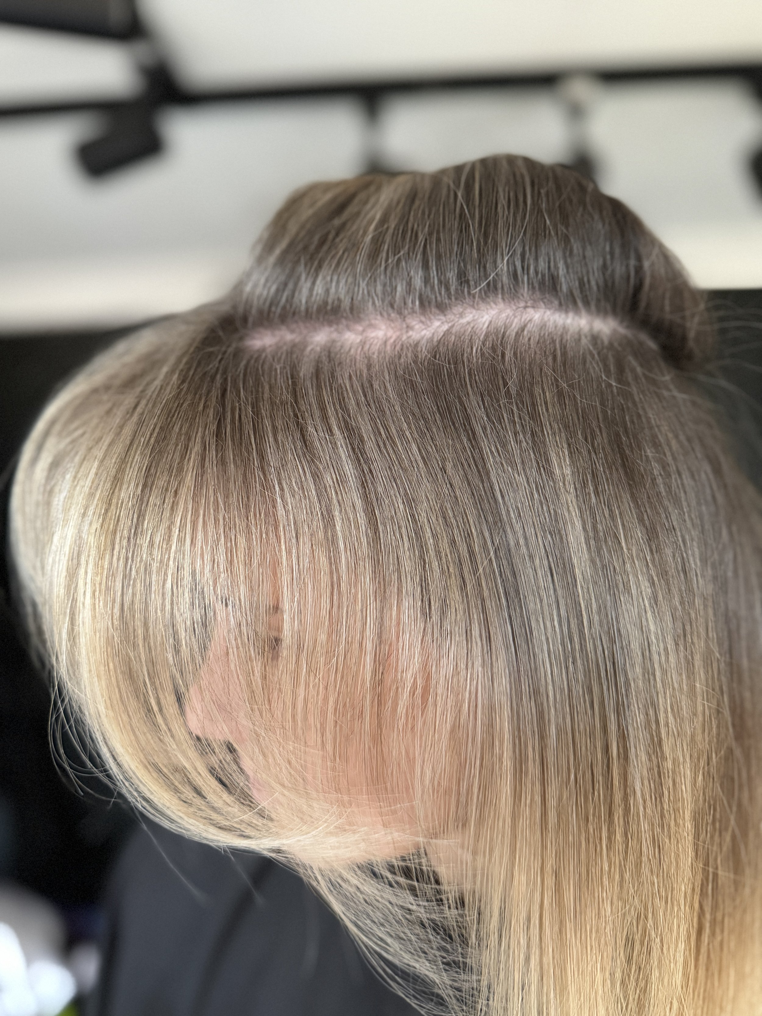 Close-up of grey roots blending into soft blonde lengths, Stephen William Hair, Hampshire