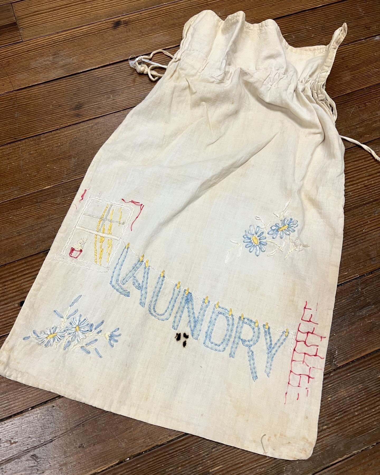 the most precious antique hand embroidered laundry bag 🪡 i love the way they did the brick detail and the tiny yellow clothes pins ☺️