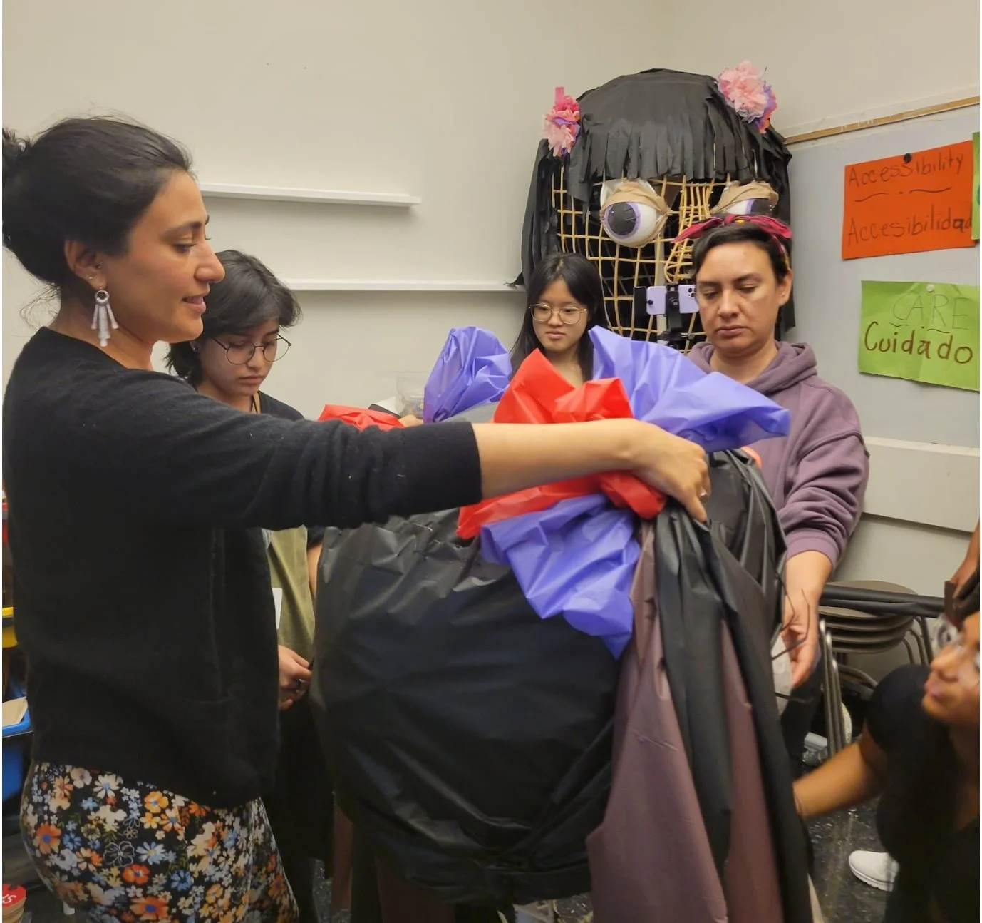Ana with teen participants and FL artist Jacksubeli Gonzalez, building a giant puppet at the Guggenheim as part of Beyond the Wall, Aug 2024.