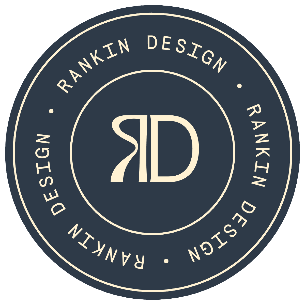 Circular logo with navy blue background and beige text that reads 'RD' in the center, surrounded by a ring of text that says 'RANKIN DESIGN' repeated twice, separated by small dots.
