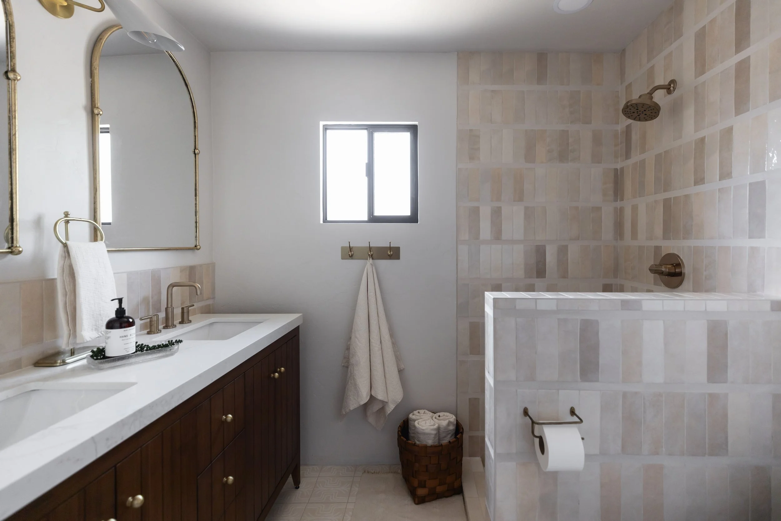 Primary bathroom in a remodeled Tucson pueblo home featuring natural stone, warm desert materials, and modern Southwest bathroom design.