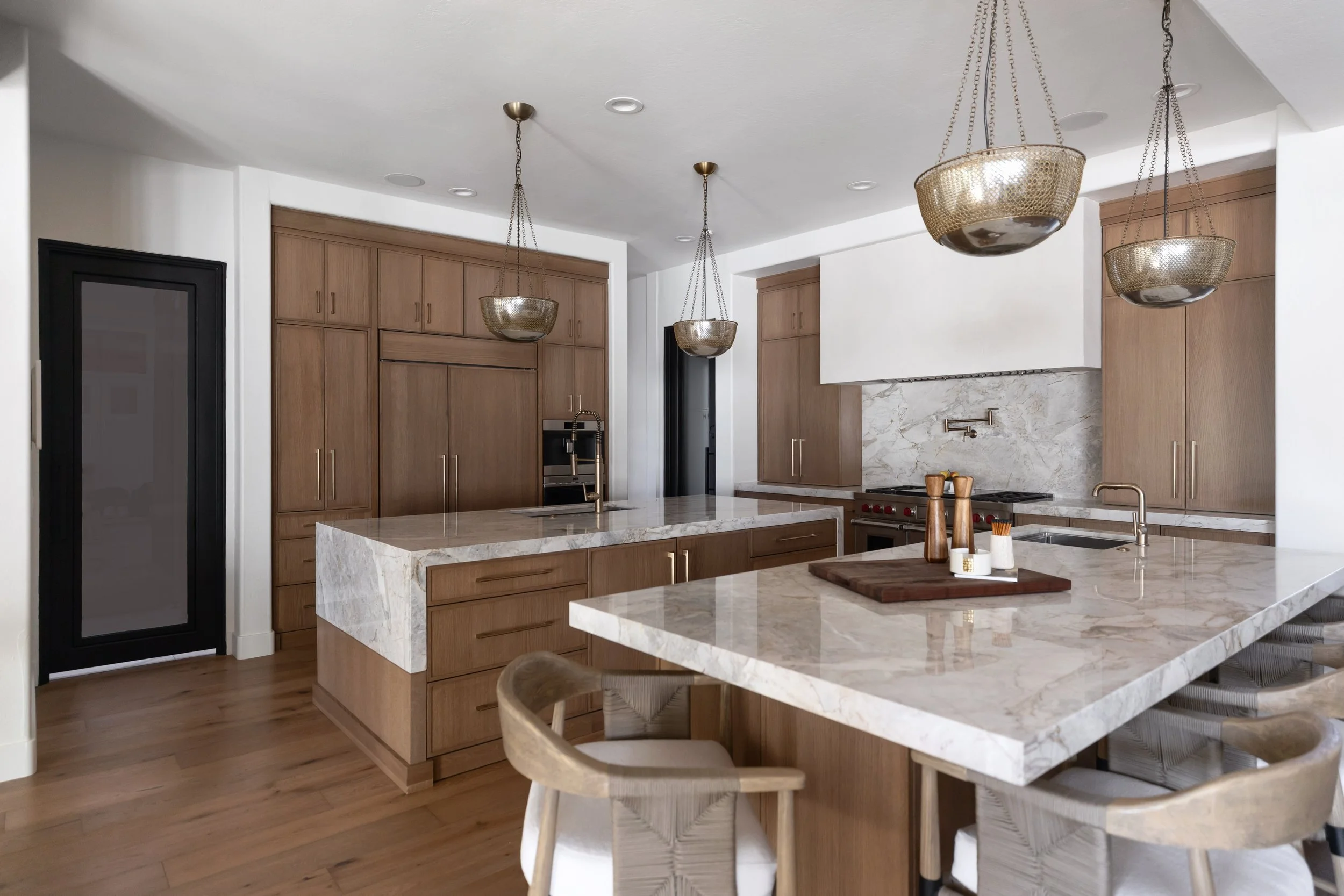 Custom kitchen design in a Phoenix, Arizona home showcasing warm wood tones, modern finishes, and a thoughtfully crafted culinary workspace.