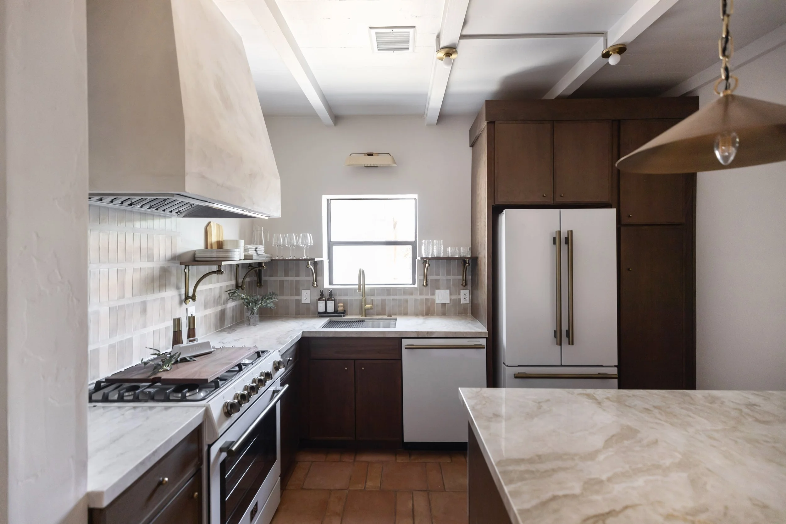 Historic Tucson kitchen remodel blending pueblo architecture with modern desert interior design and functional open-concept layout.