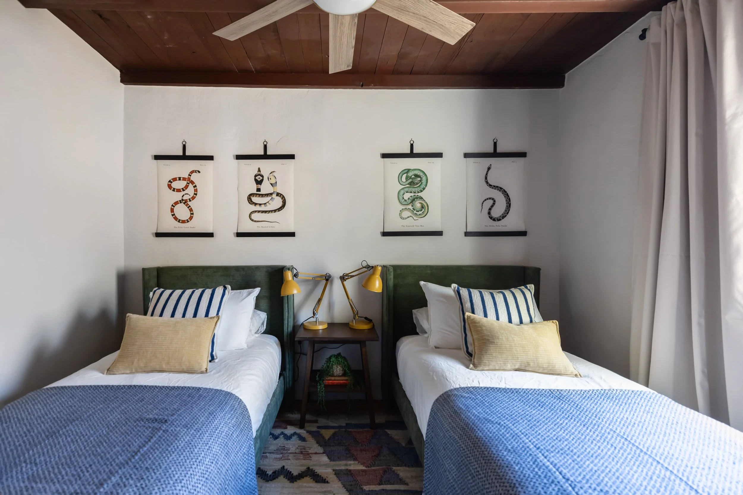 Youth bedroom in a historic Tucson pueblo home designed with warm neutrals, playful textures, and modern desert-inspired interior design.