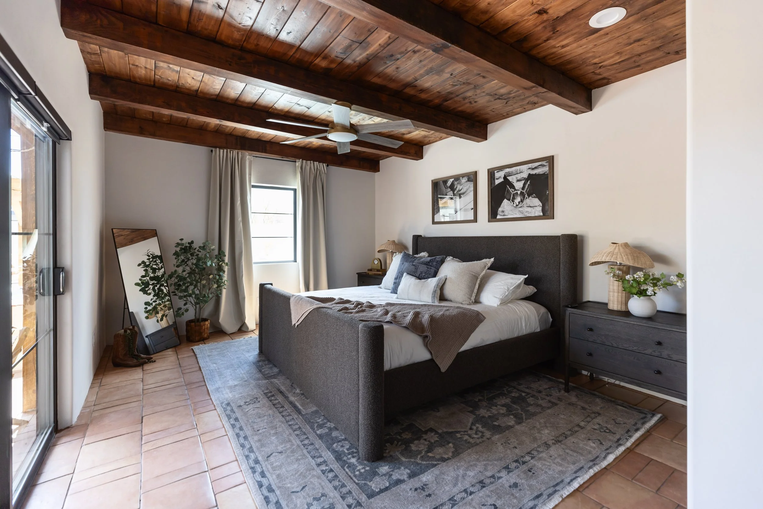 Primary bedroom retreat in a historic pueblo home in Tucson, Arizona featuring soft neutral colors, natural textures, and relaxed desert modern interior design.