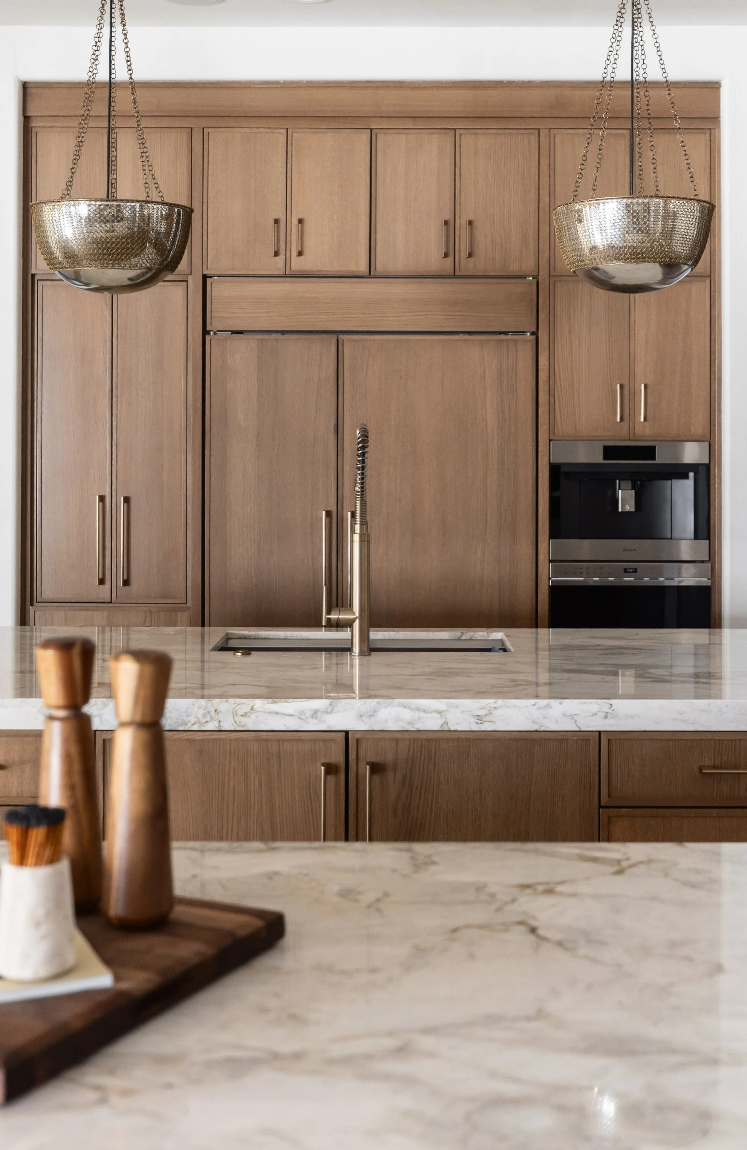 Custom cabinetry and modern kitchen design inside a renovated home in a historic Phoenix suburb.