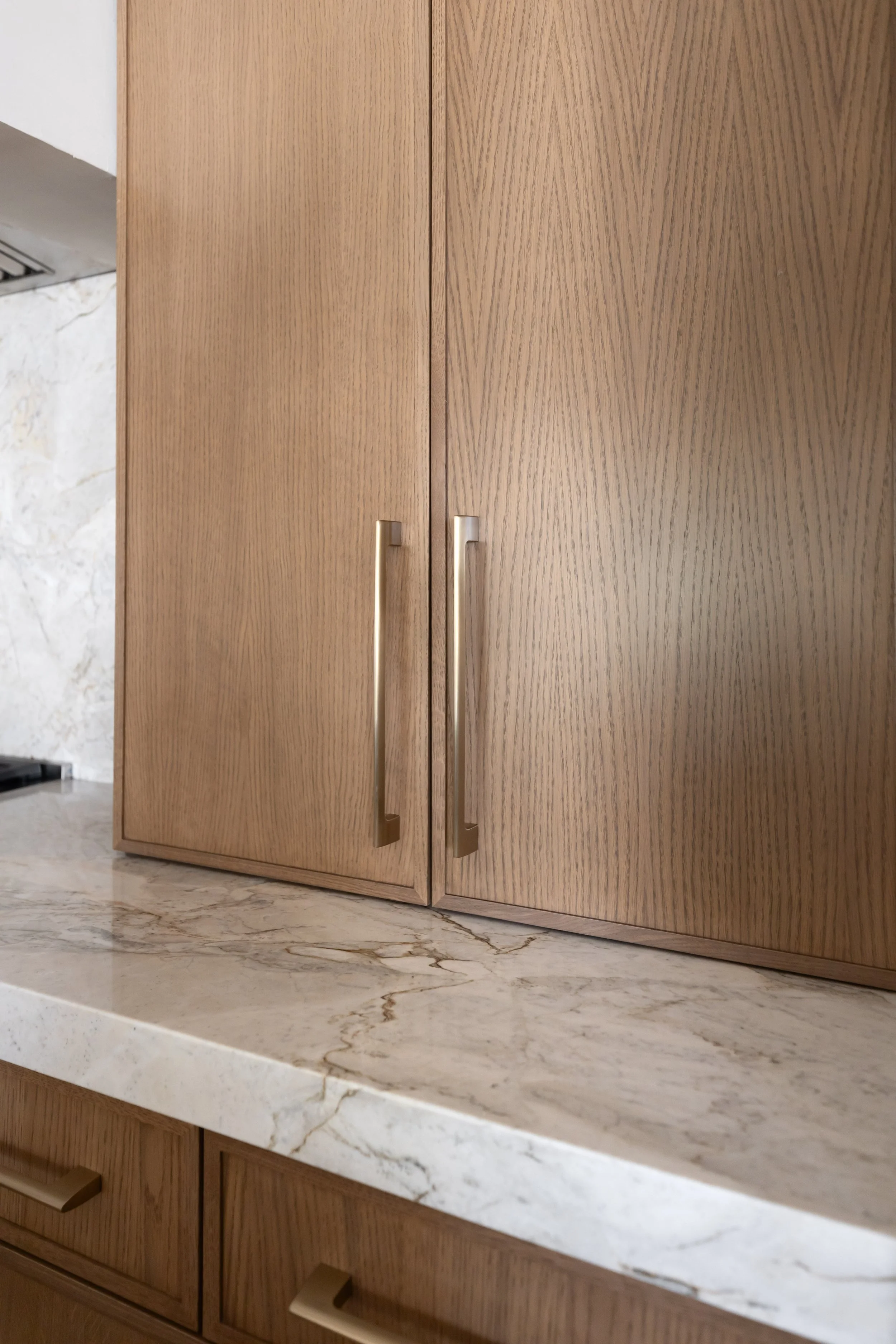 Detailed view of modern kitchen cabinetry and finishes in a Phoenix kitchen renovation with desert-inspired interior design.