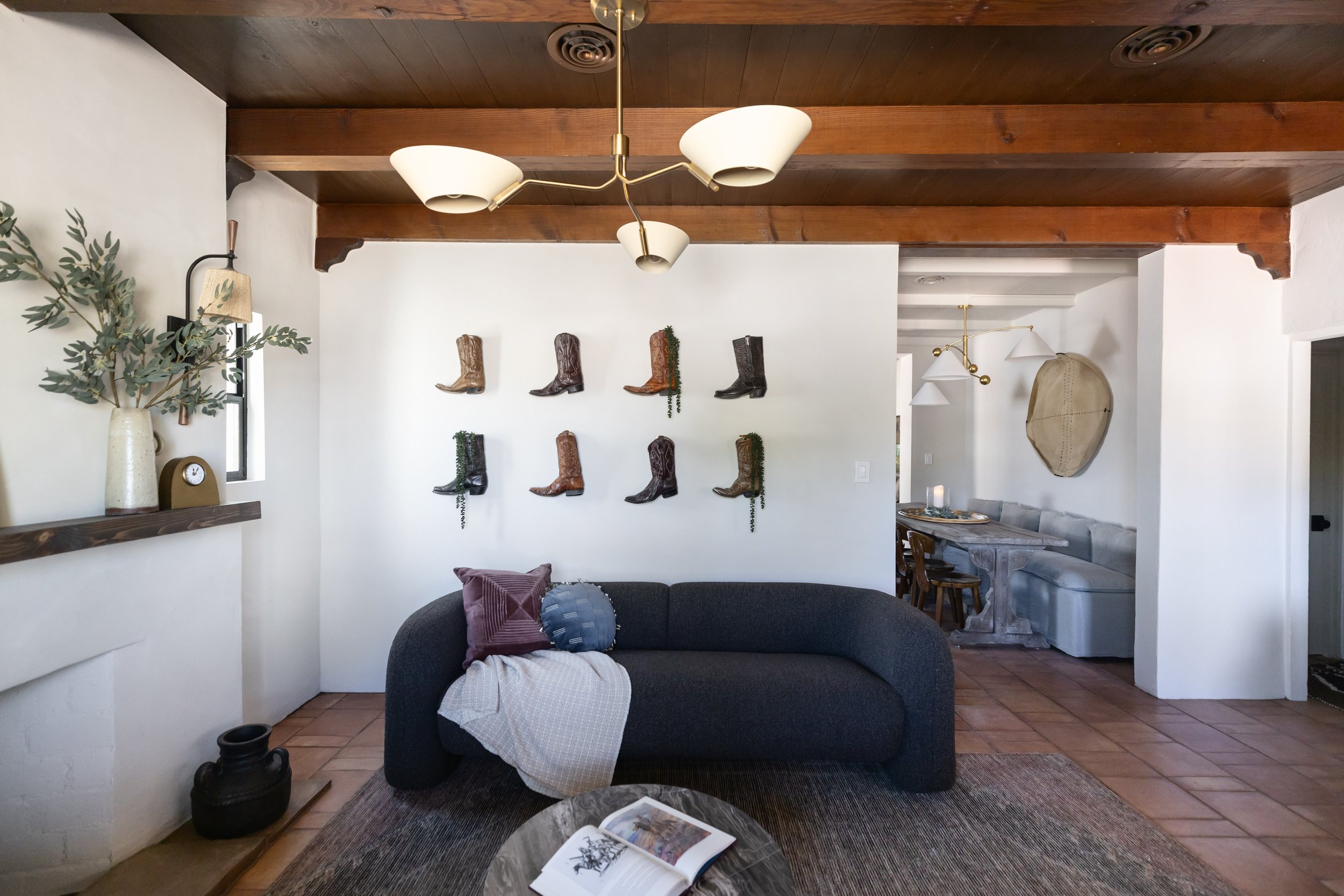Bright living space in a historic Tucson pueblo house showcasing warm desert materials, natural light, and relaxed modern Southwest interior styling.