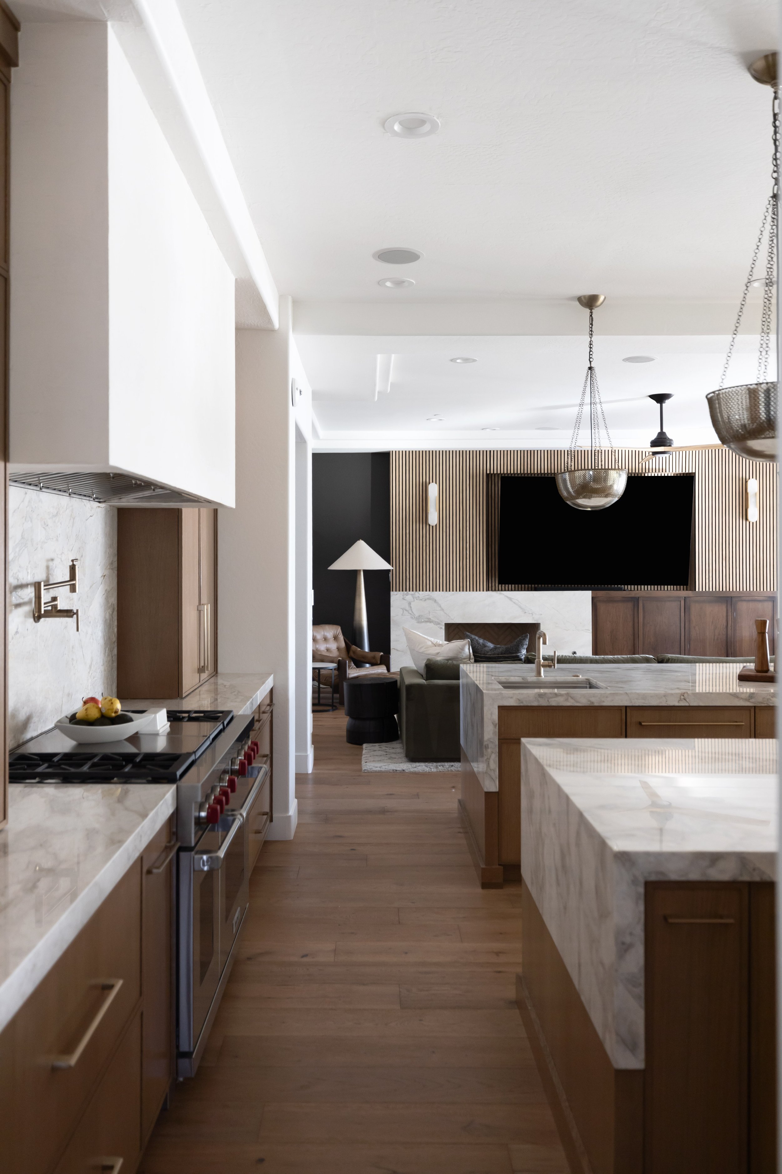 Modern desert kitchen design highlighting natural textures, warm wood cabinetry, and an open layout ideal for cooking and gathering.