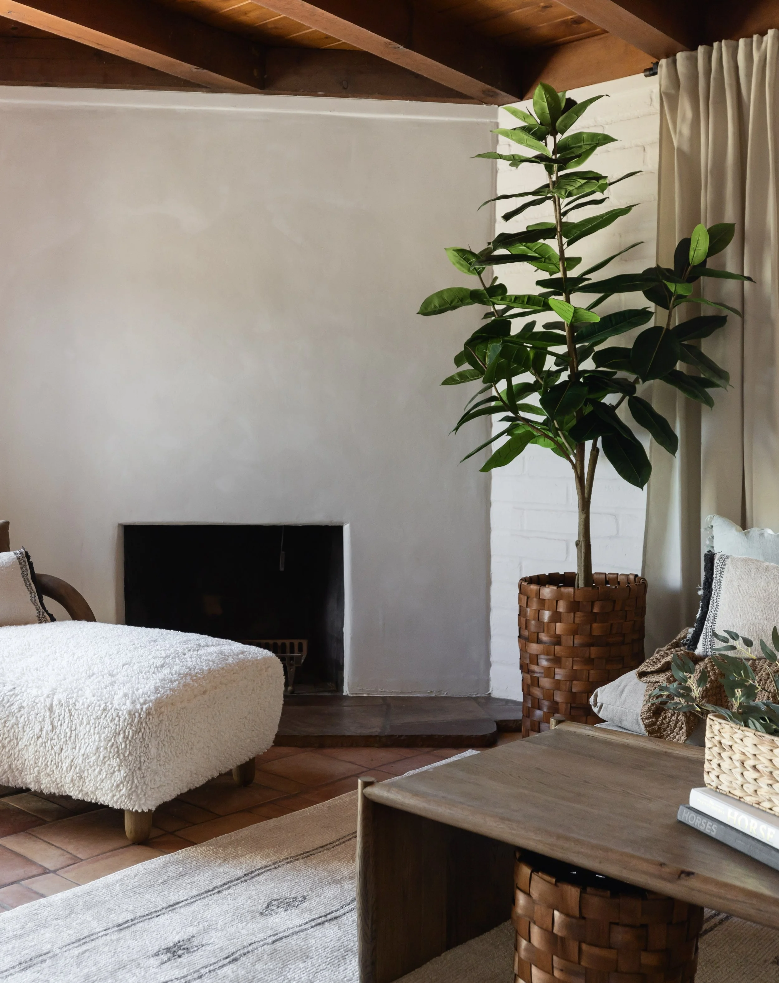 Historic pueblo home family room remodel in Tucson, Arizona showcasing layered textiles, warm woods, and relaxed desert-inspired interiors.