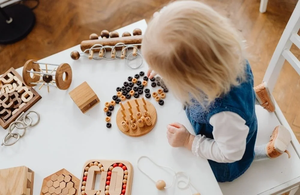 A child learning independently in Montessori environment