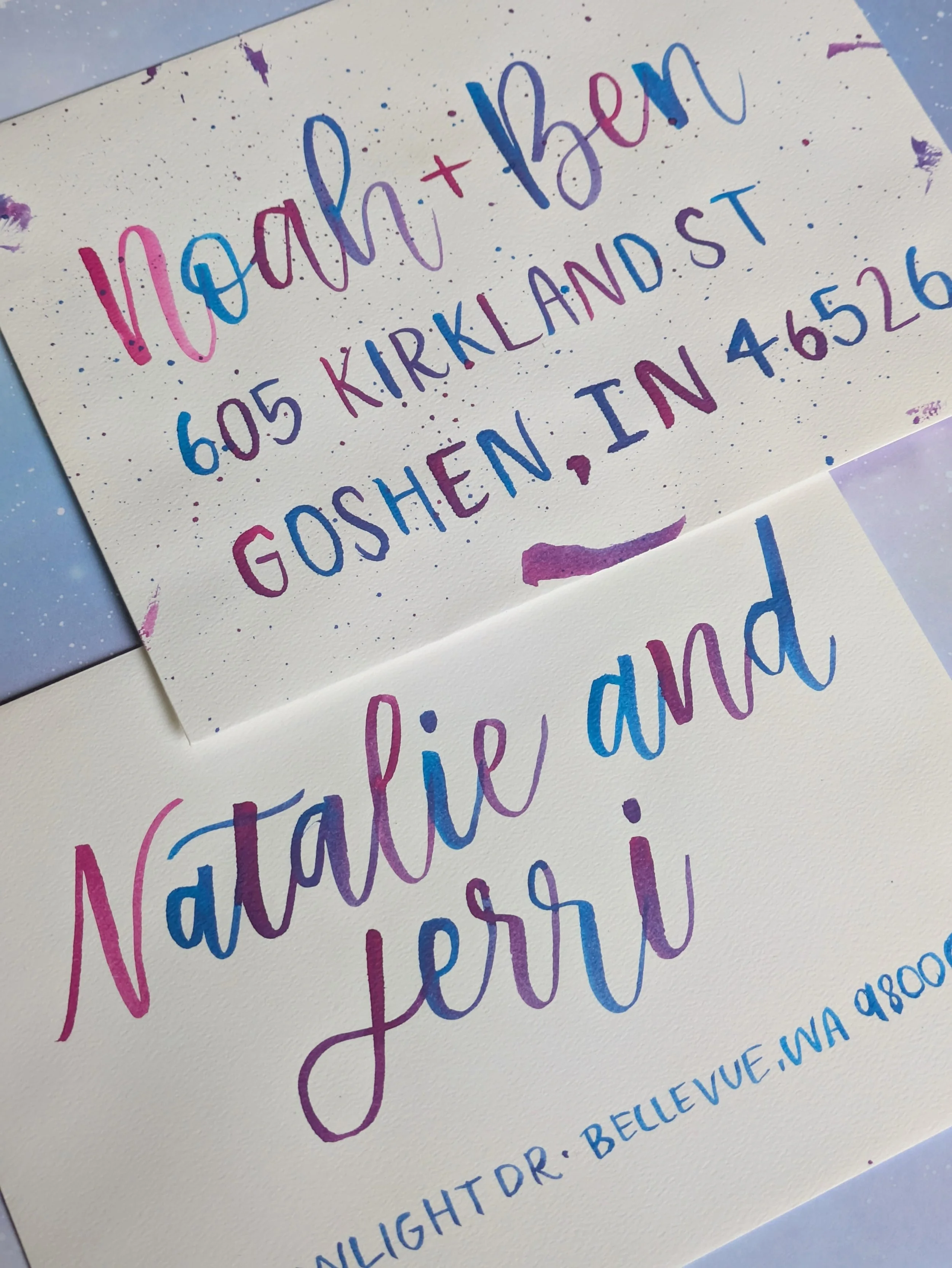 Two envelopes with watercolor brush lettering, variegated with an ombre between blue and pink