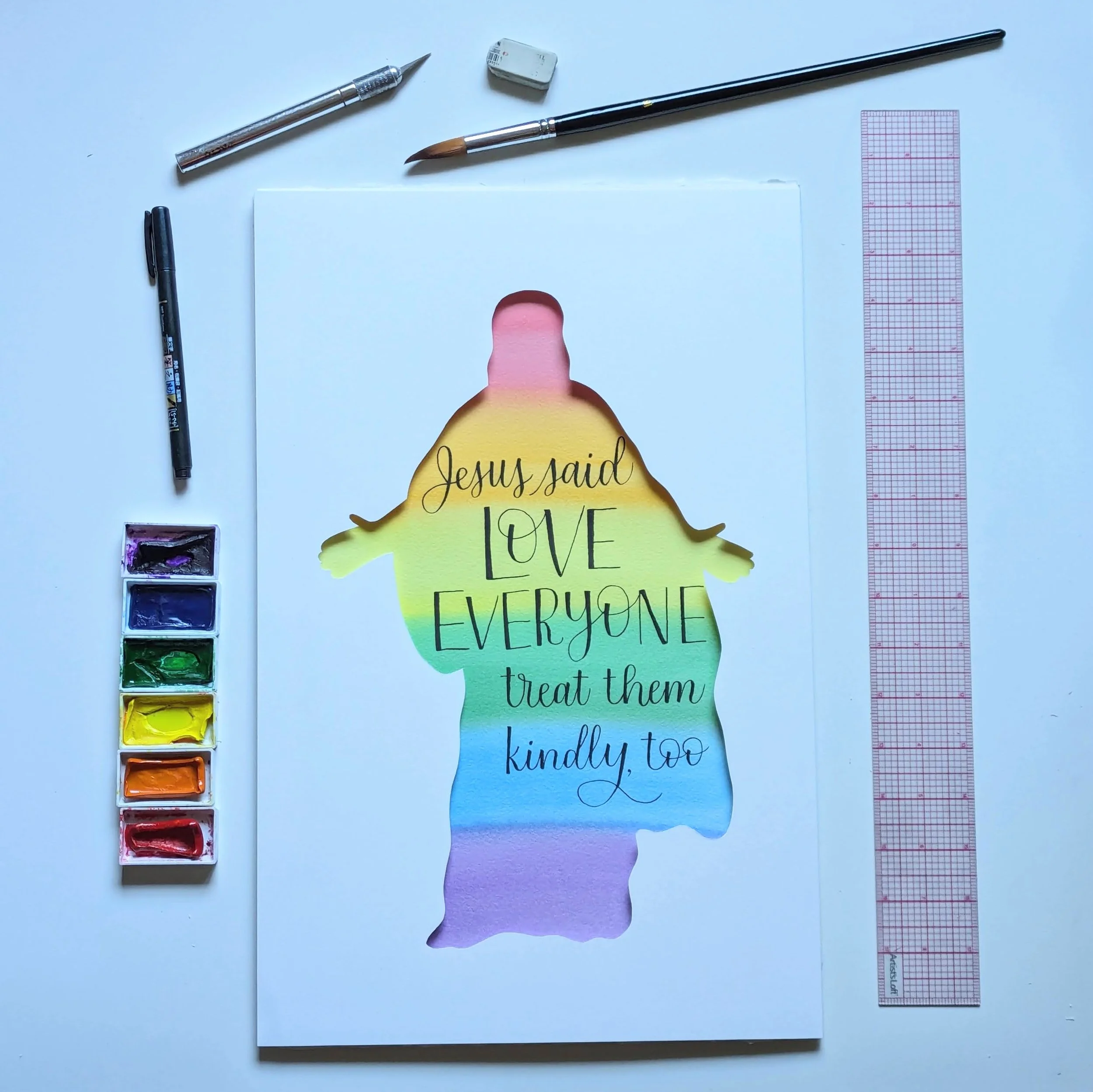silhouette cutout of Jesus over rainbow watercolor wash with text reading: "Jesus said LOVE EVERYONE treat them kindly, too" in brush calligraphy