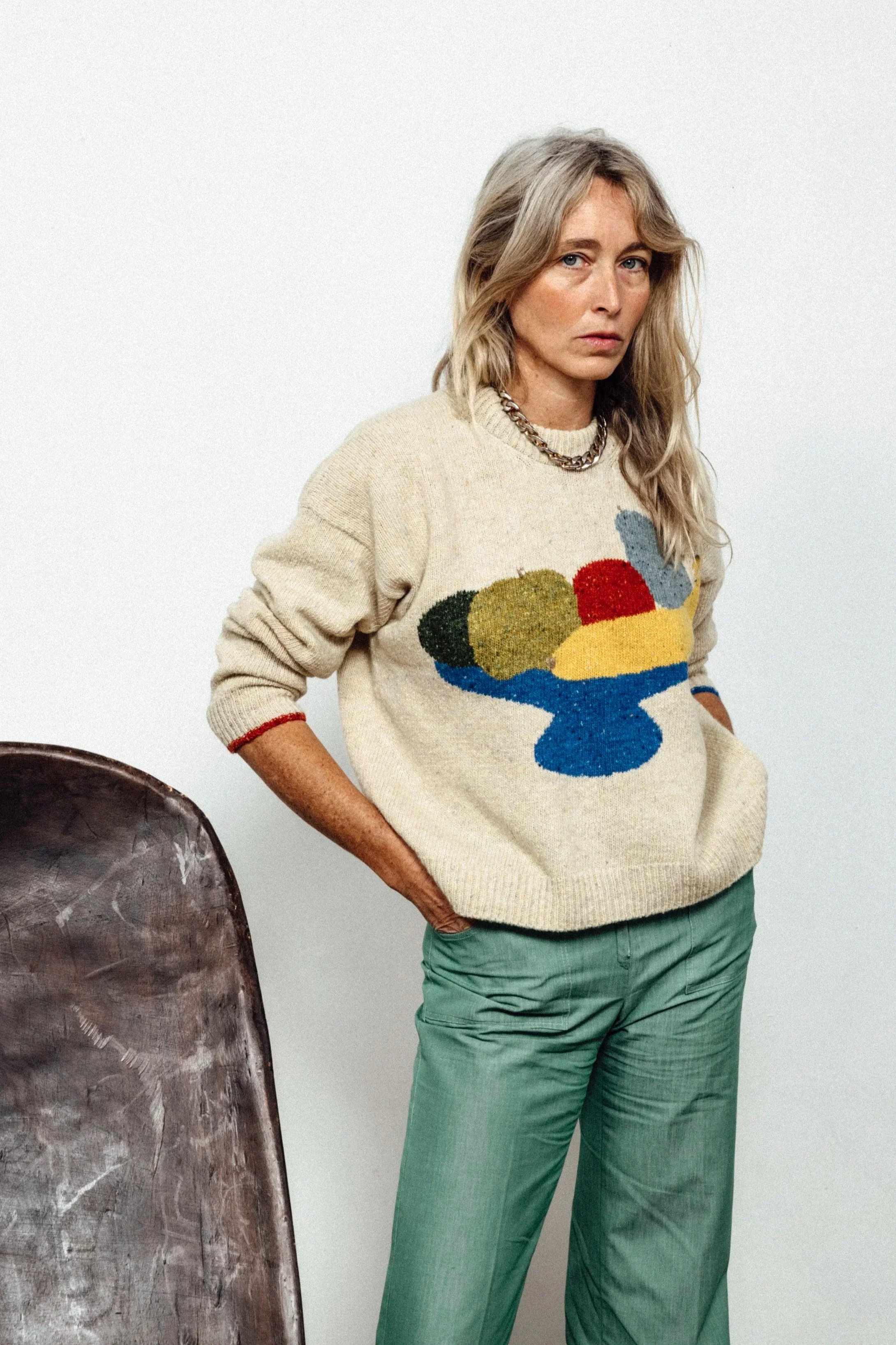 Model wearing the cream Fruit Bowl Sweater, hand-knit by Studio Kelsey