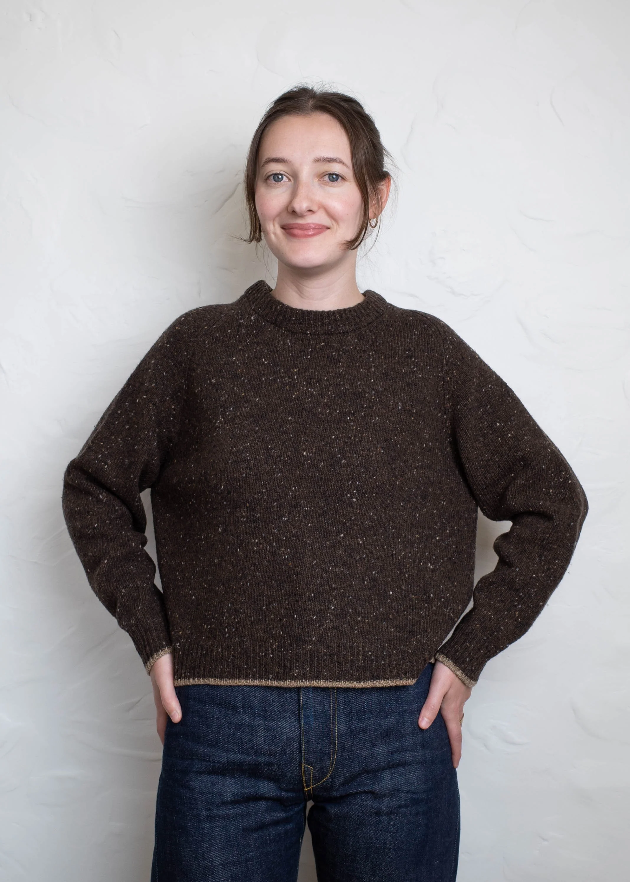 Everyday Raglan sweater in Chocolate, front view, hands in pockets