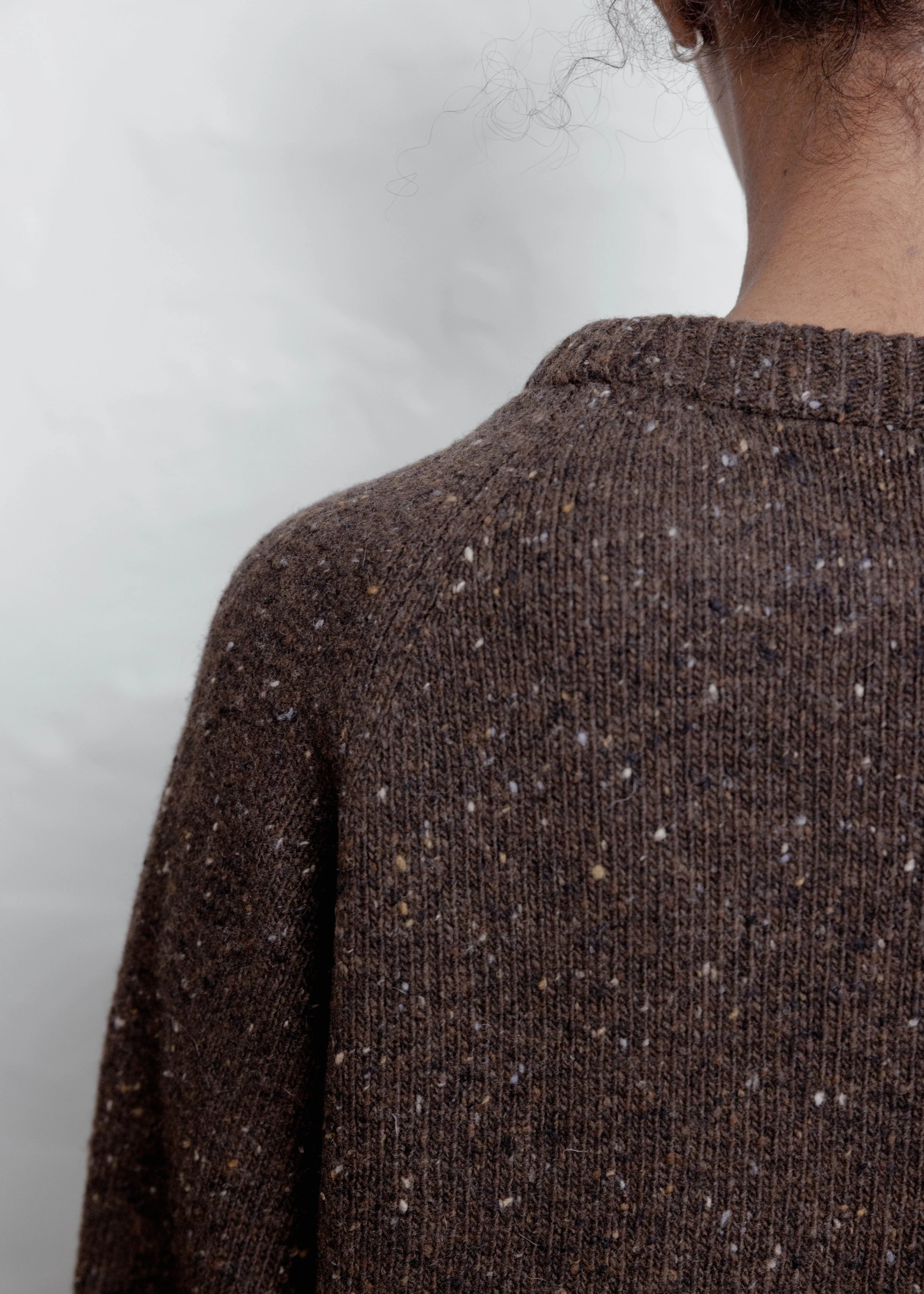 Everyday Raglan sweater in Chocolate, close-up of the flecked knit and raglan shoulder