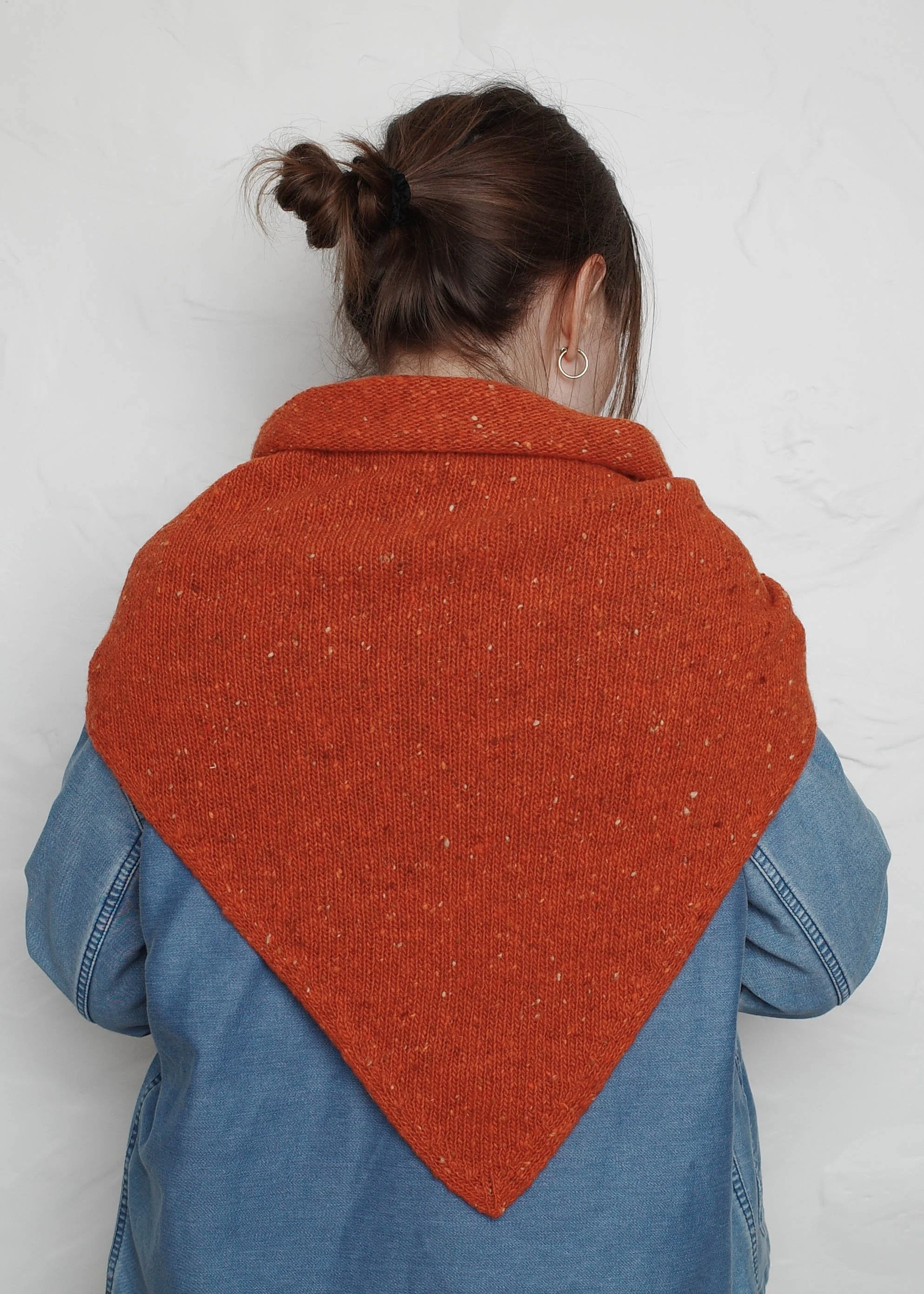 XL Knit Bandana in Lobster Red, draped over a denim jacket, back view