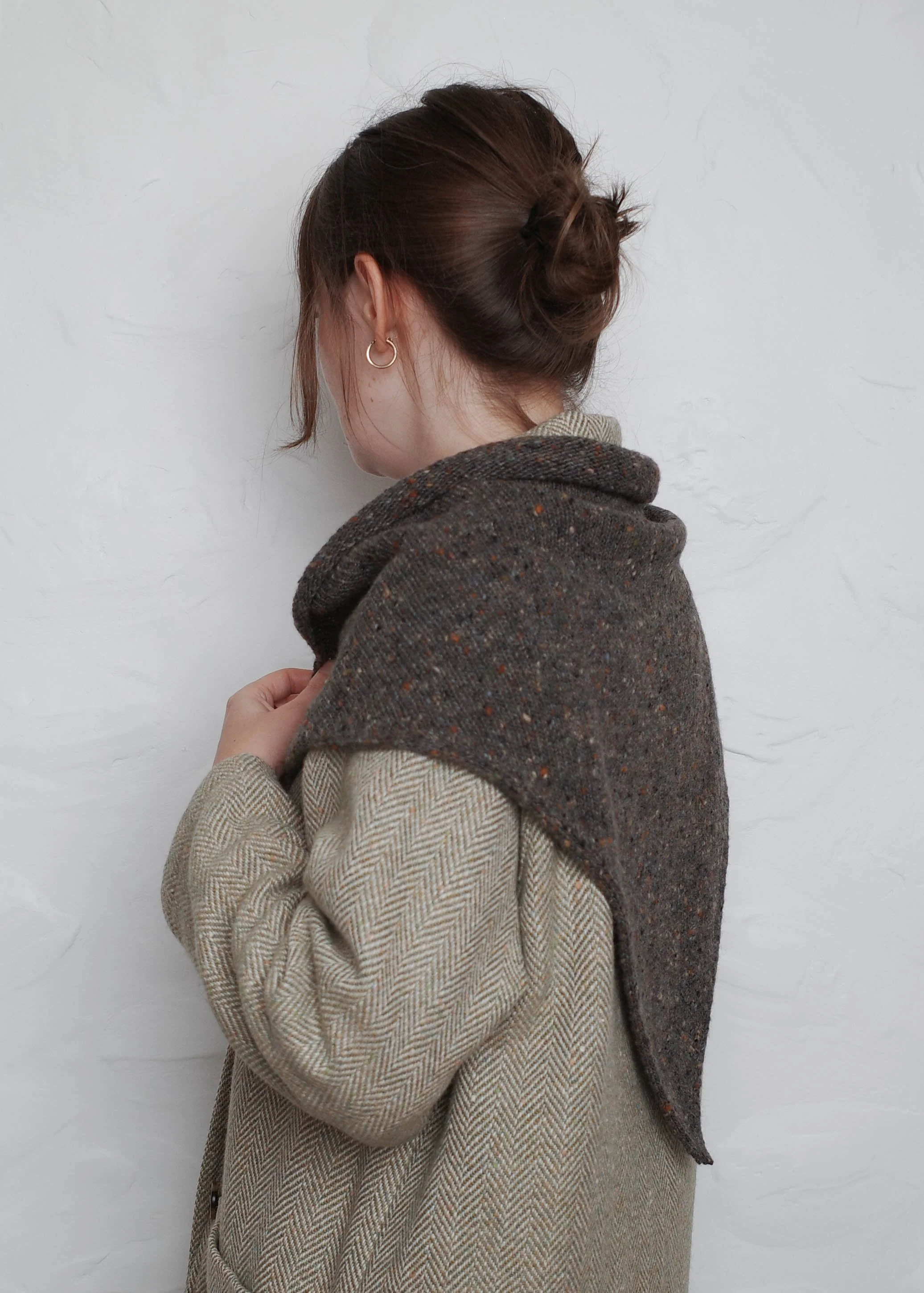 XL Knit Bandana in Umber, worn over a coat, side view