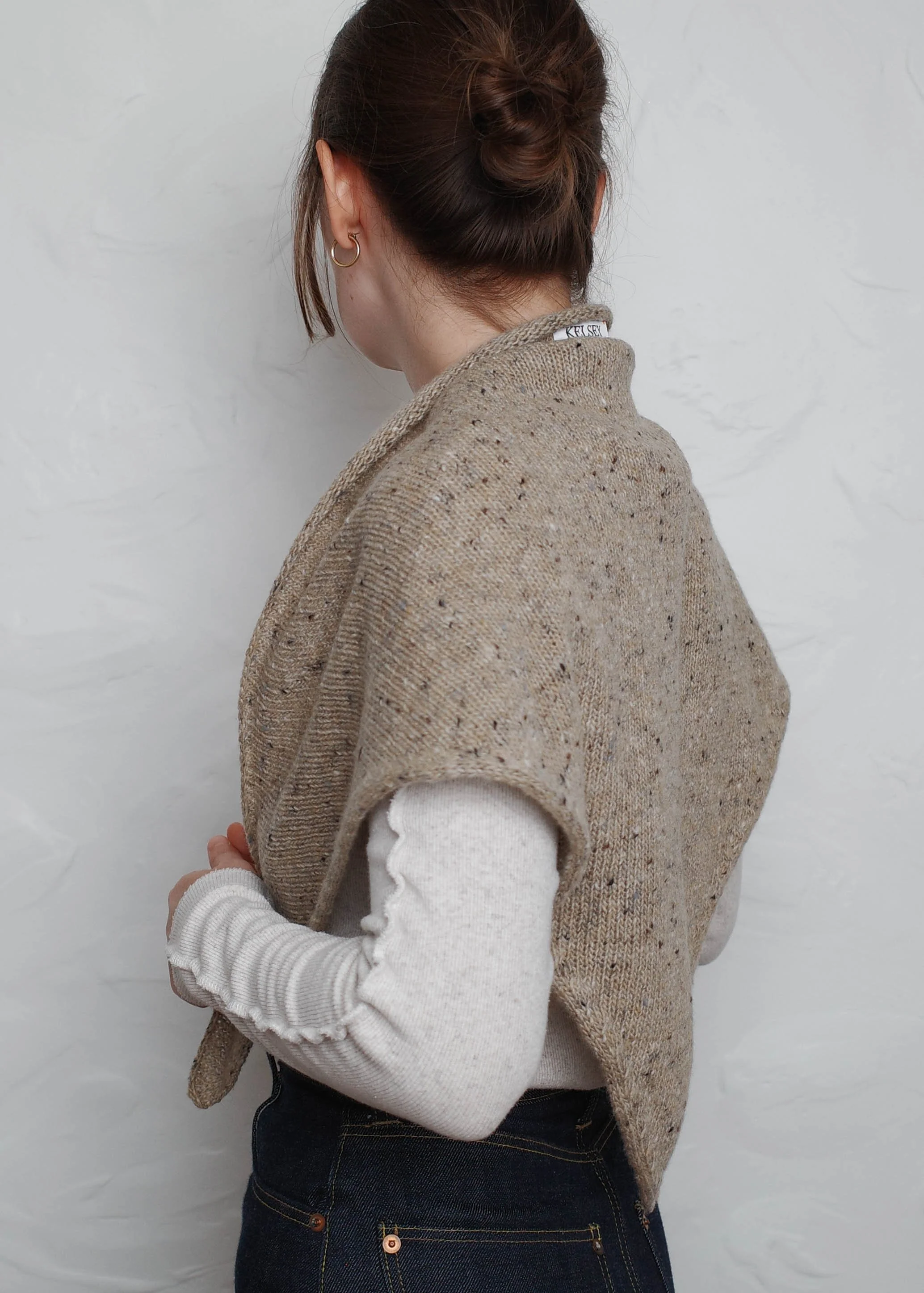 XL Knit Bandana in Oat, worn over the shoulders, side view